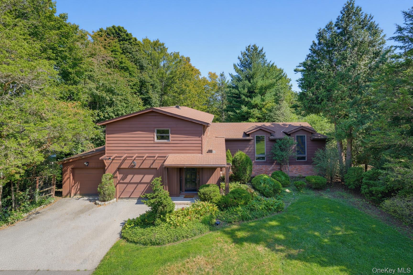 Set back from the street on a landscaped lot, a private 3-bedroom, 2.5...