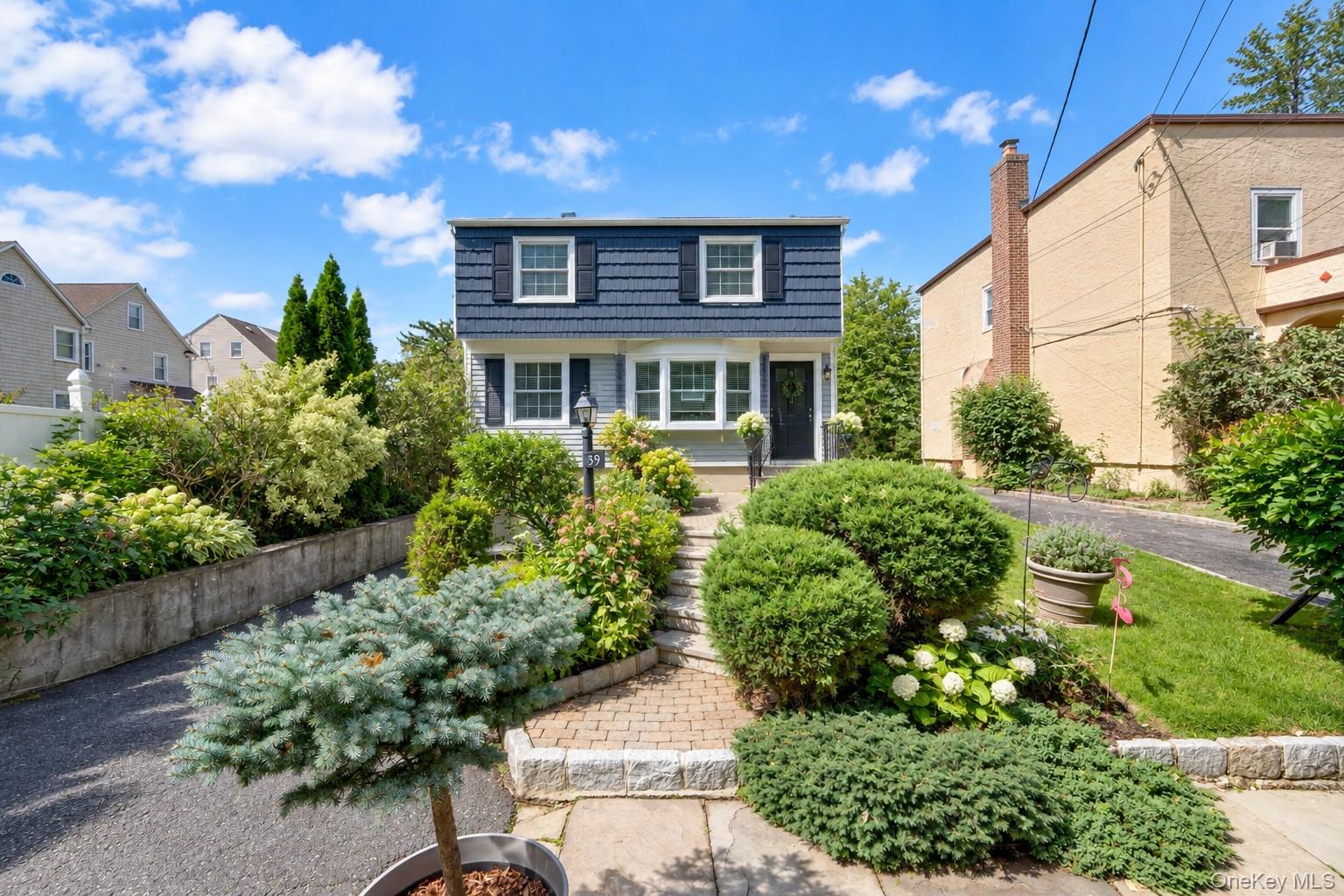 Welcome to this inviting home tucked away on a tree-lined dead-end str...