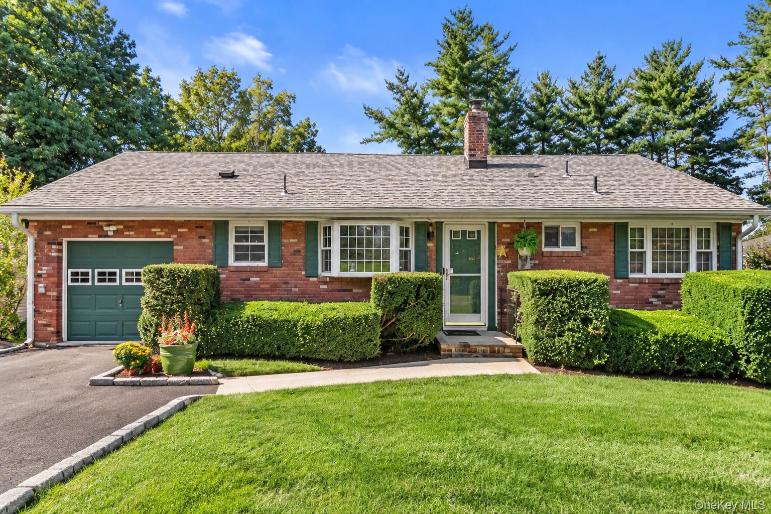 Picture-perfect curb appeal welcomes you home to this charming three-b...