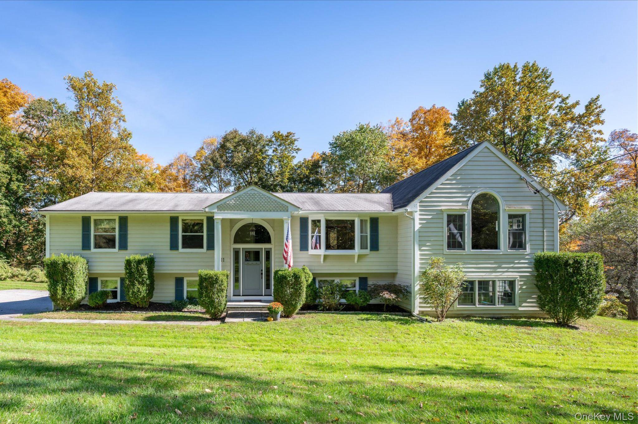 Set on nearly three private, wooded acres, this exquisitely expanded H...