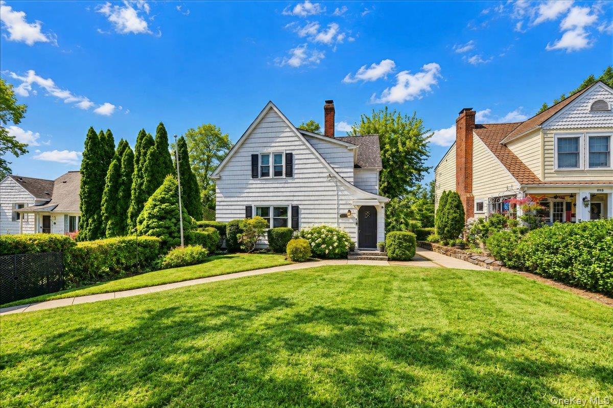 Welcome to 201 Park Drive, a striking Tudor-style residence that perfe...