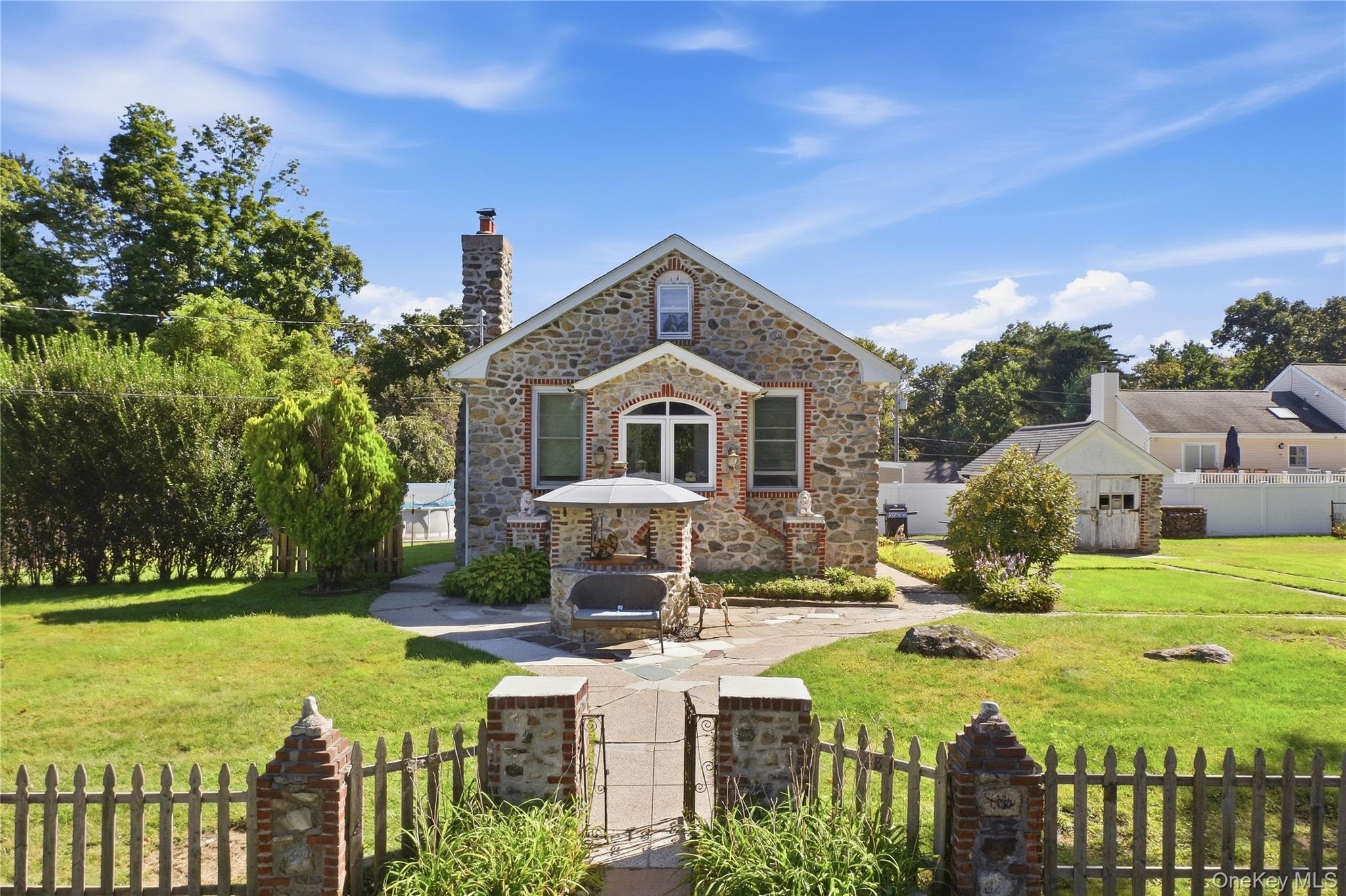 Storybook classic 2-bedroom stone home offering convenient one-level l...
