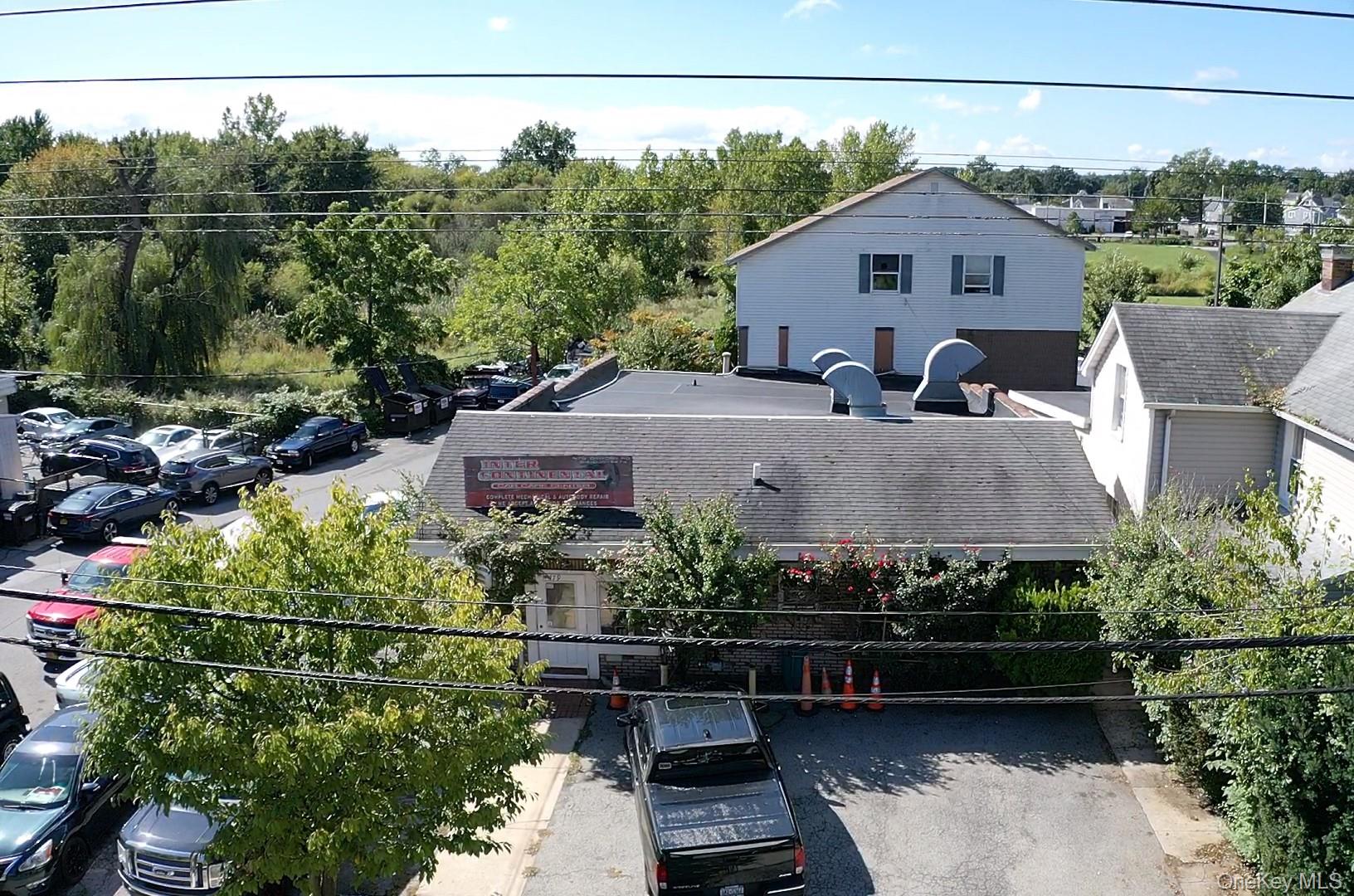 Rare turnkey mixed-use investment and business opportunity featuring a...