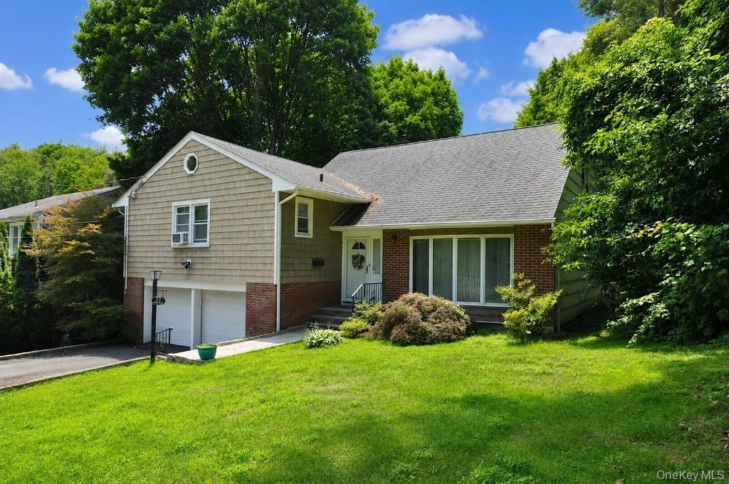 Welcome to 12 Charlotte Place, a well-maintained split-level home tuck...