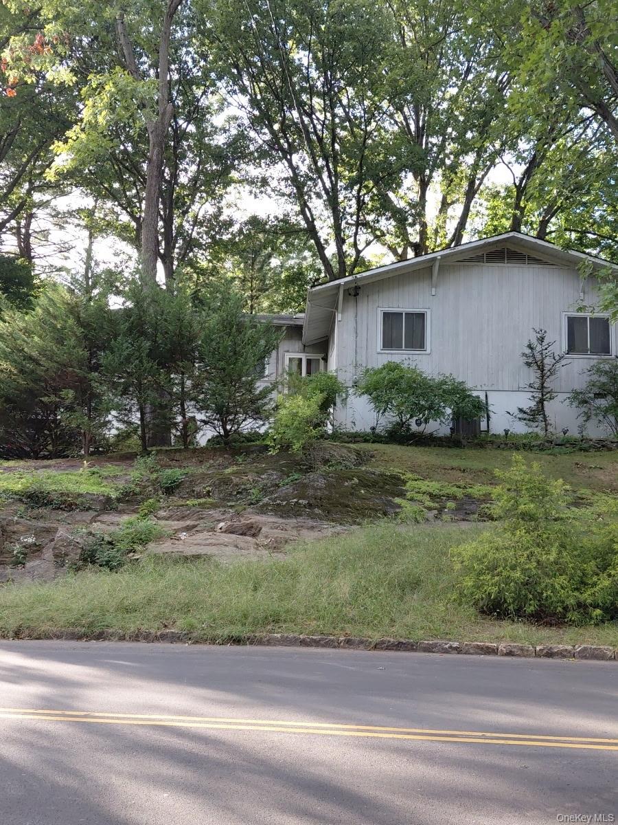 Welcome to 26 Soundview Drive, a charming Mid-Century Modern/Contempor...