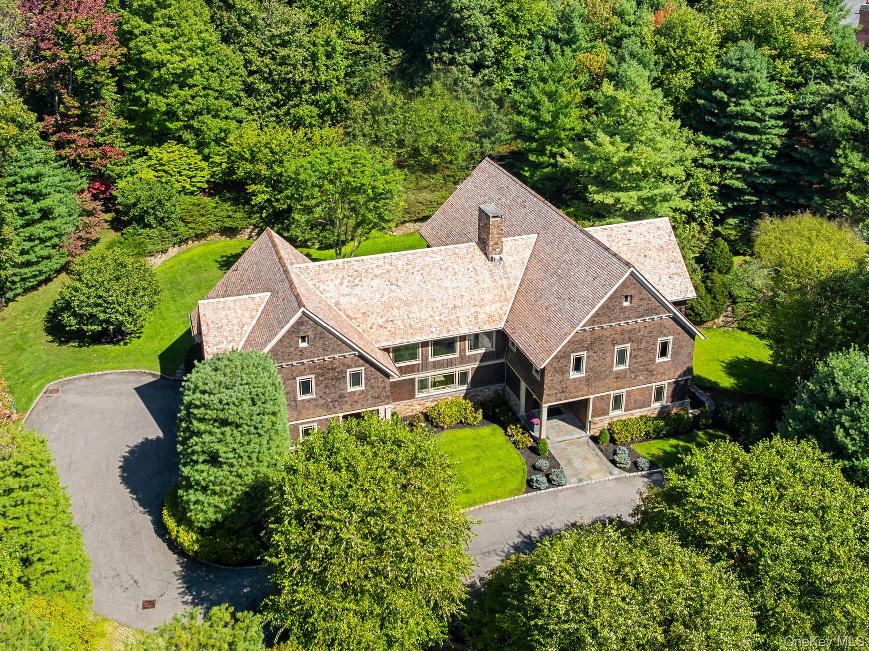 This Nantucket style, seven-bedroom, custom home brings unexpected arc...