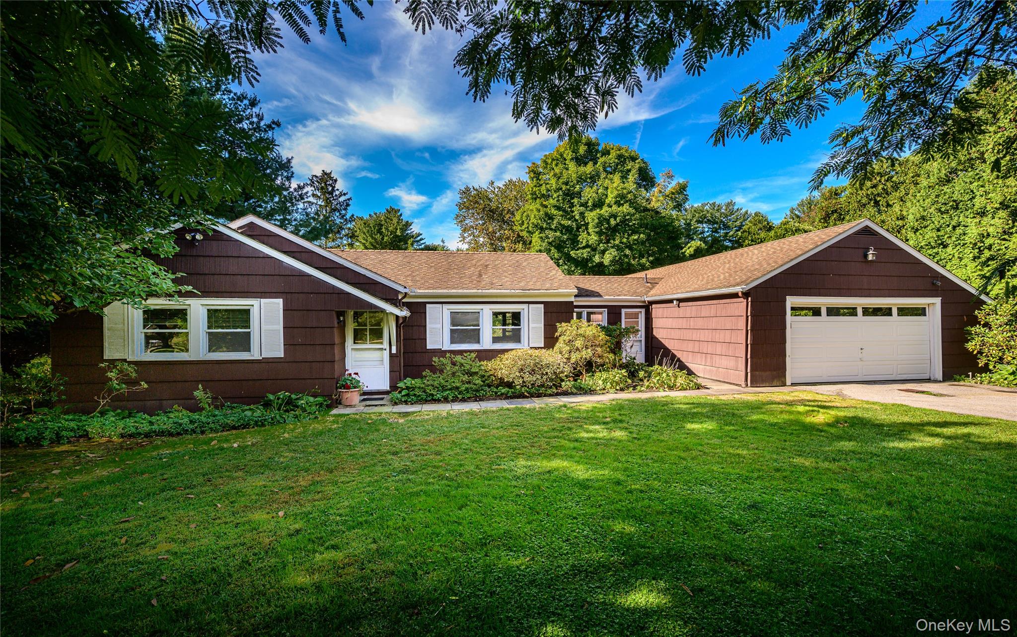 Bring your vision to this 1950s one-level Ranch, gracefully set on a f...