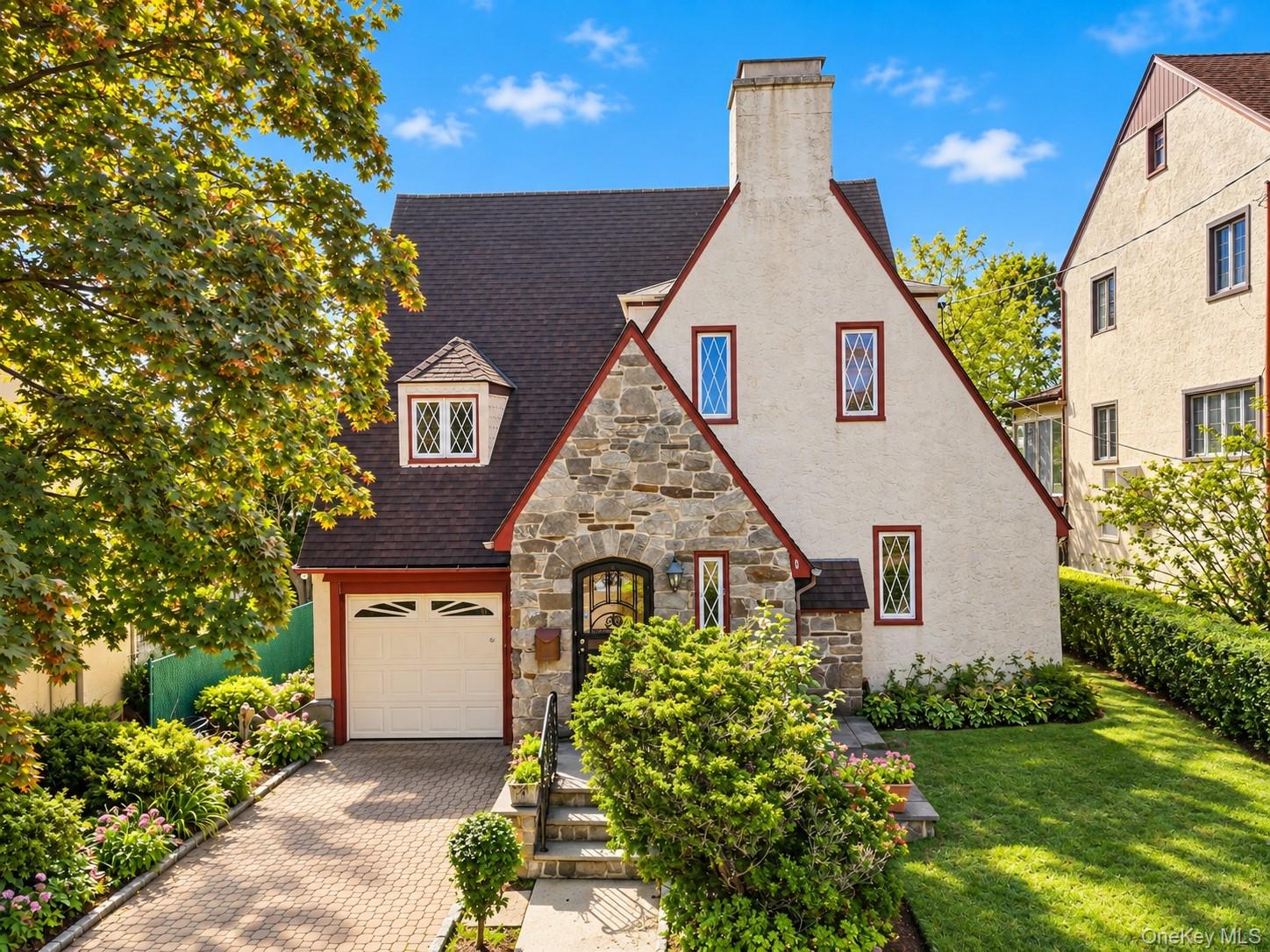 Welcome to 187 Neuton Avenue, a beautifully charming Tudor-style resid...