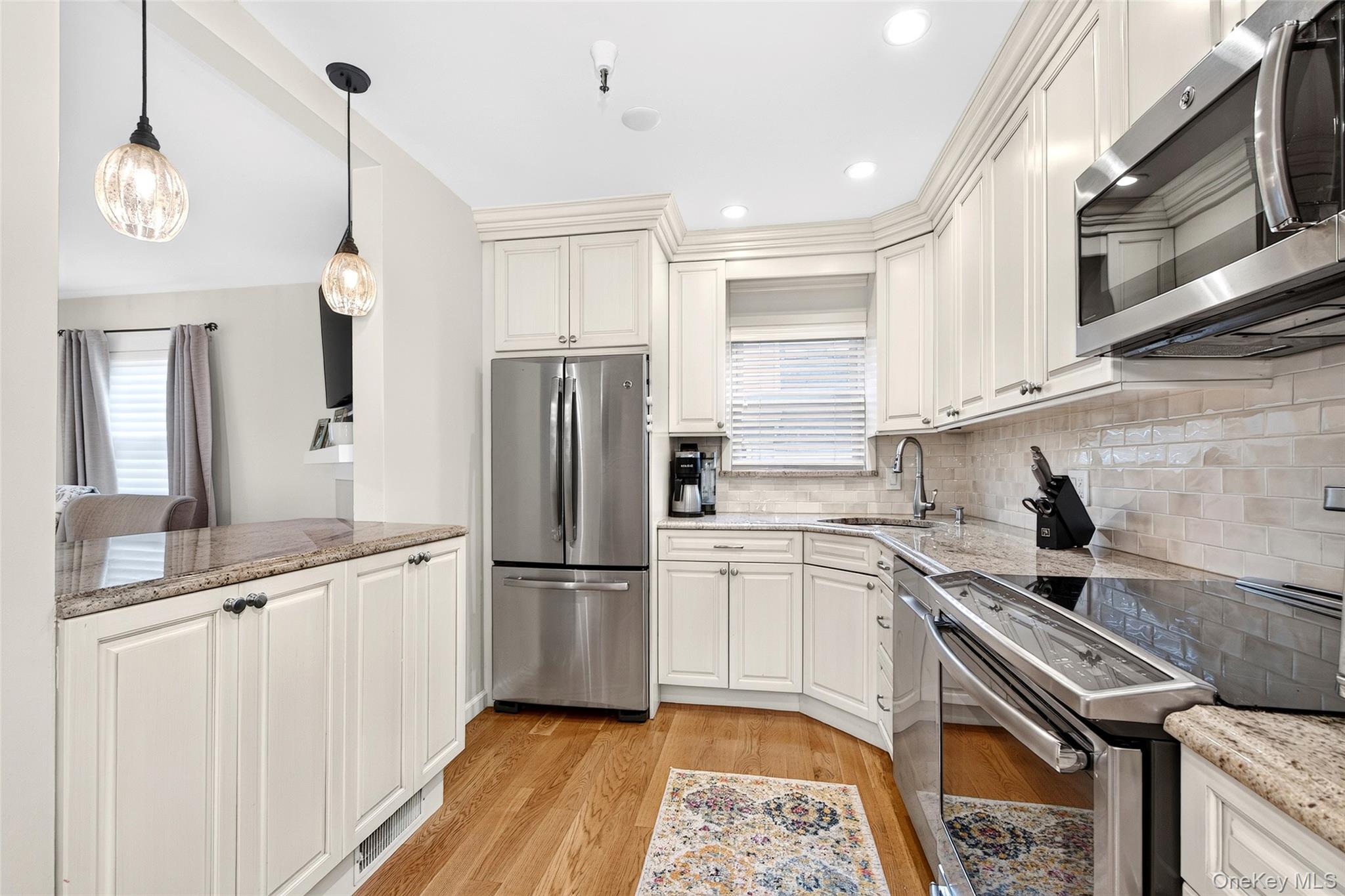Move right into to this beautiful end unit townhome located on a resid...