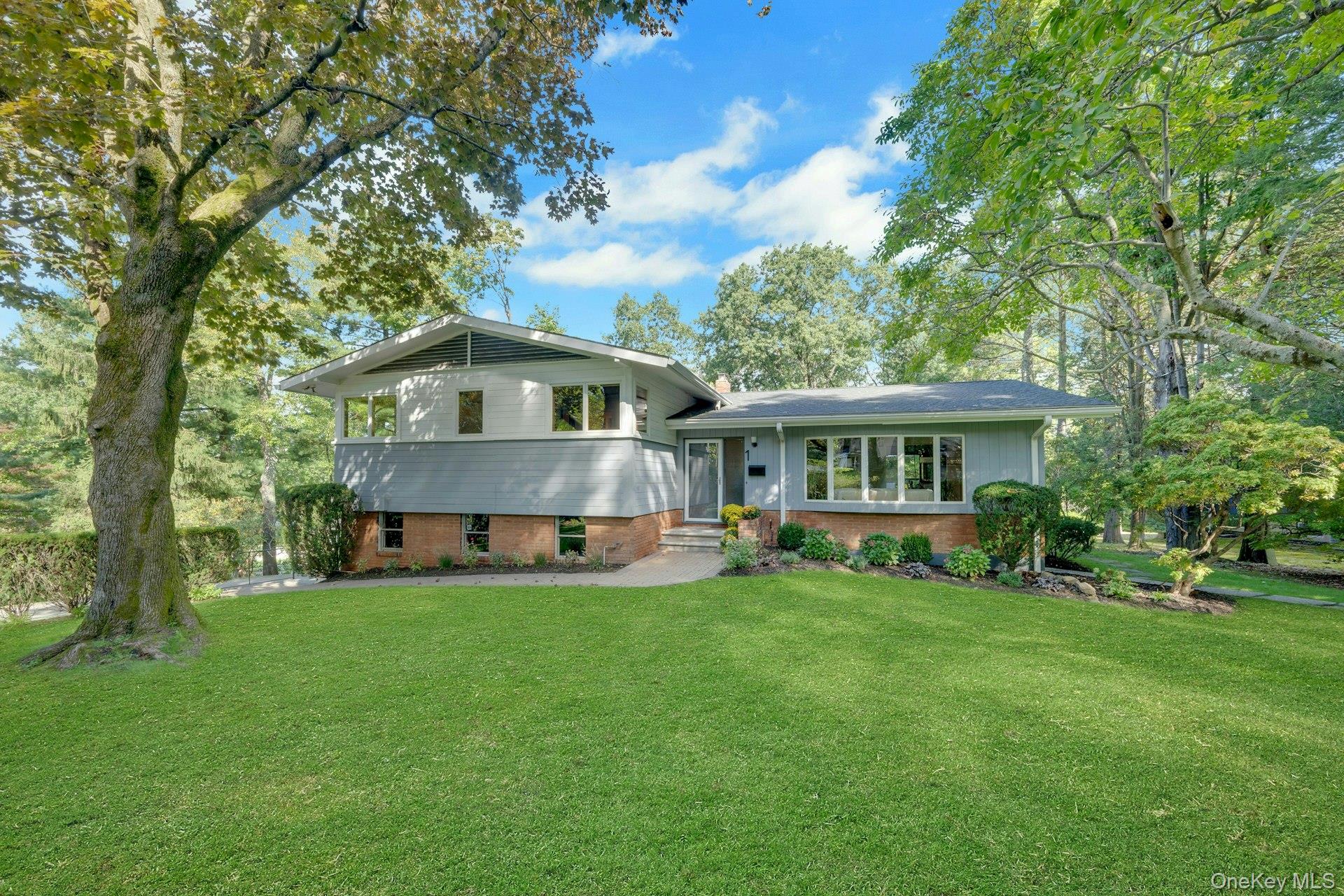 Welcome to this updated mid-century split-level in the Edgemont School...