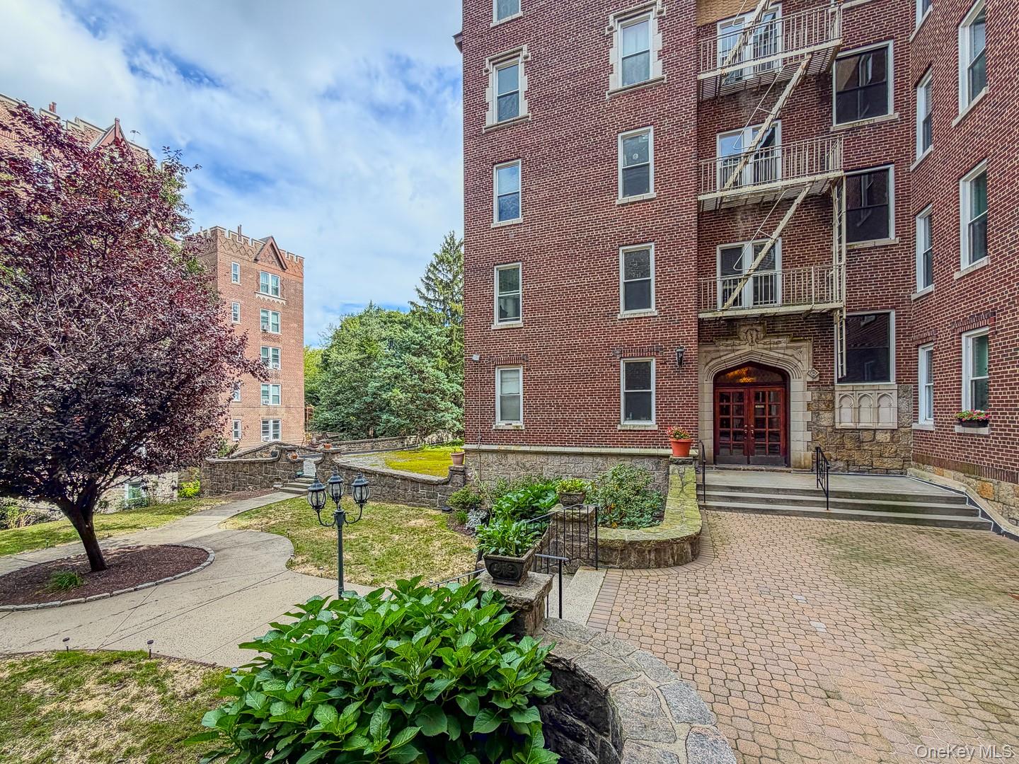 Welcome to a beautiful tudor style building that is sure to impress. T...