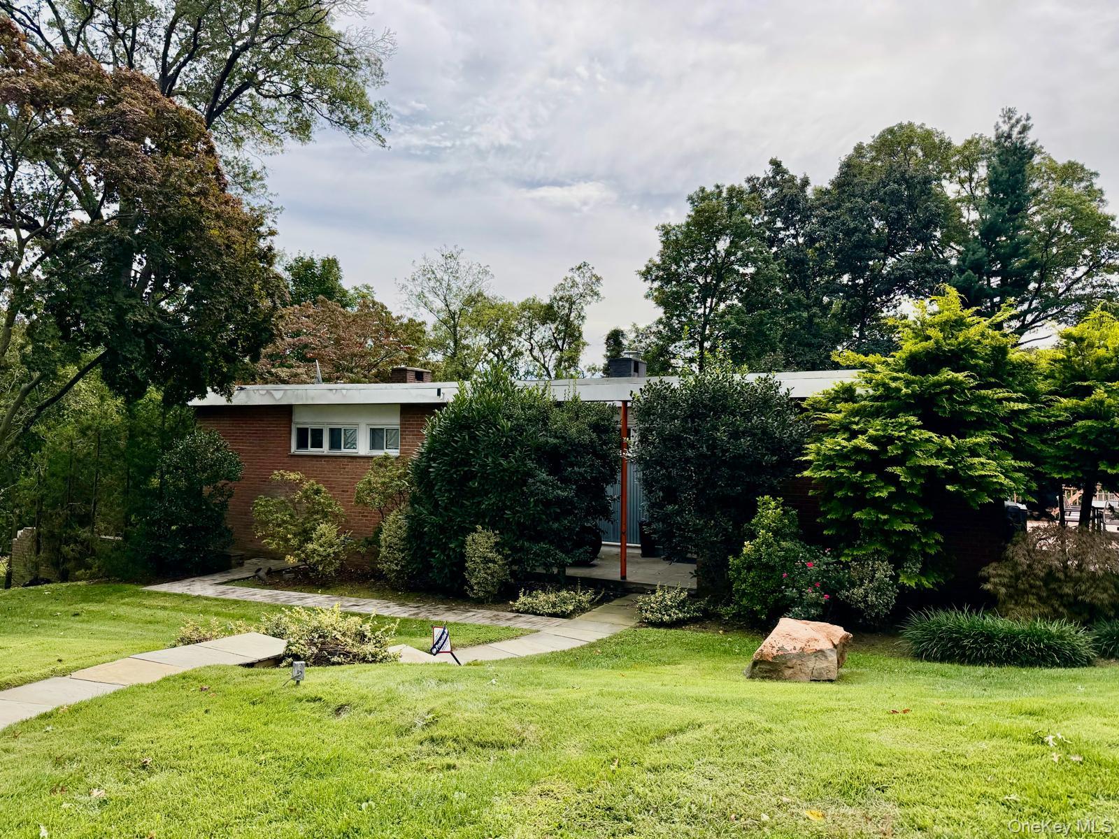 Welcome to your serene Scarsdale sanctuary. Set on a sprawling 0.75 ac...