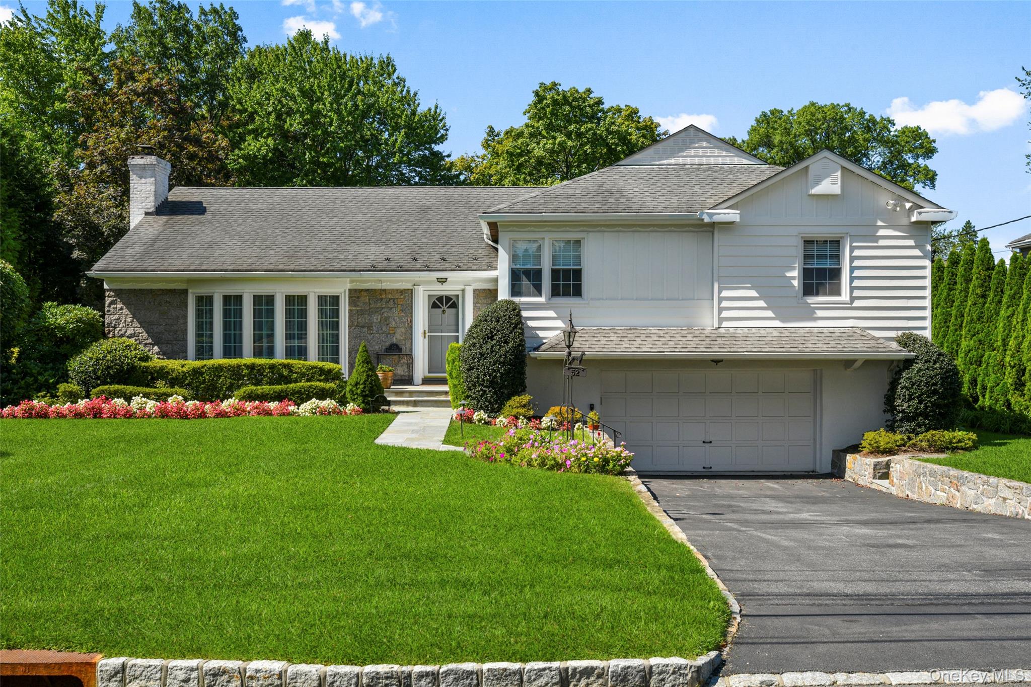 This sparkling, move-in ready home sits on a meticulously landscaped ....
