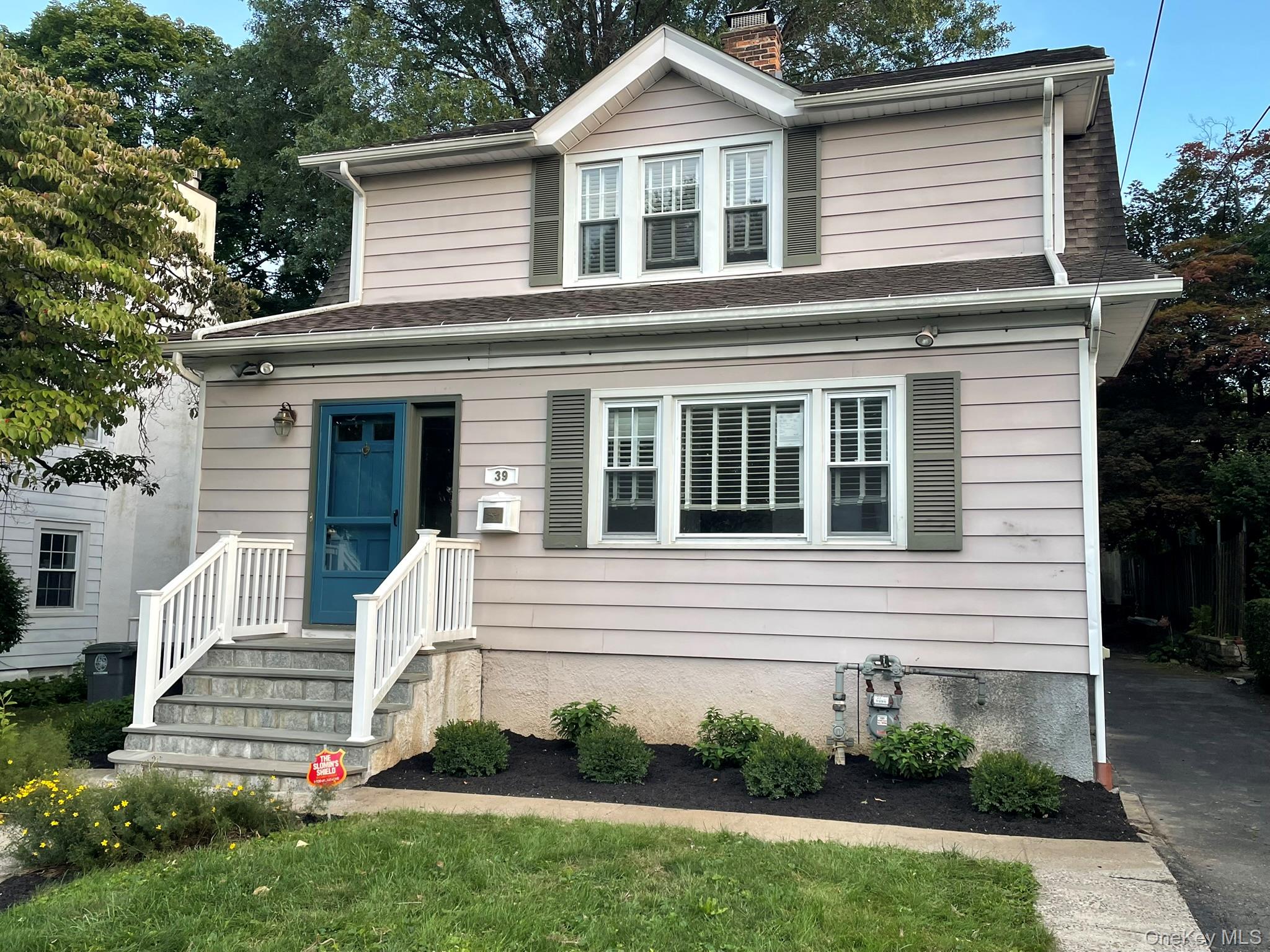 Charming 3-bedroom Colonial with hardwood floors throughout on a spaci...