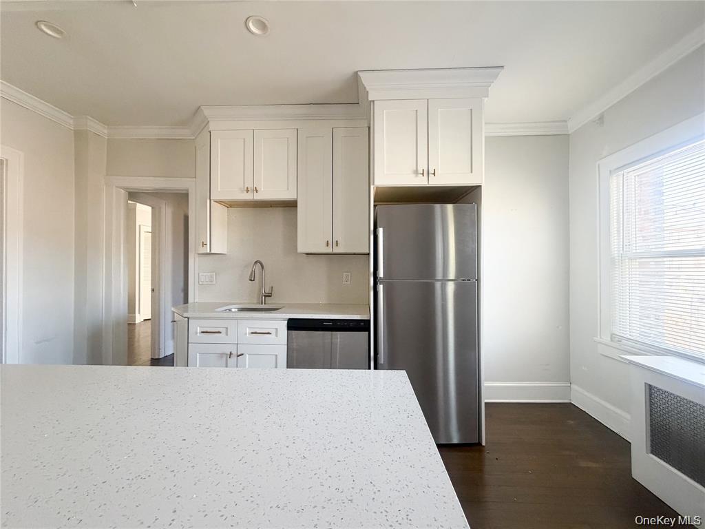 Welcome to Minerva Place! This expansive two-bedroom apartment is fill...