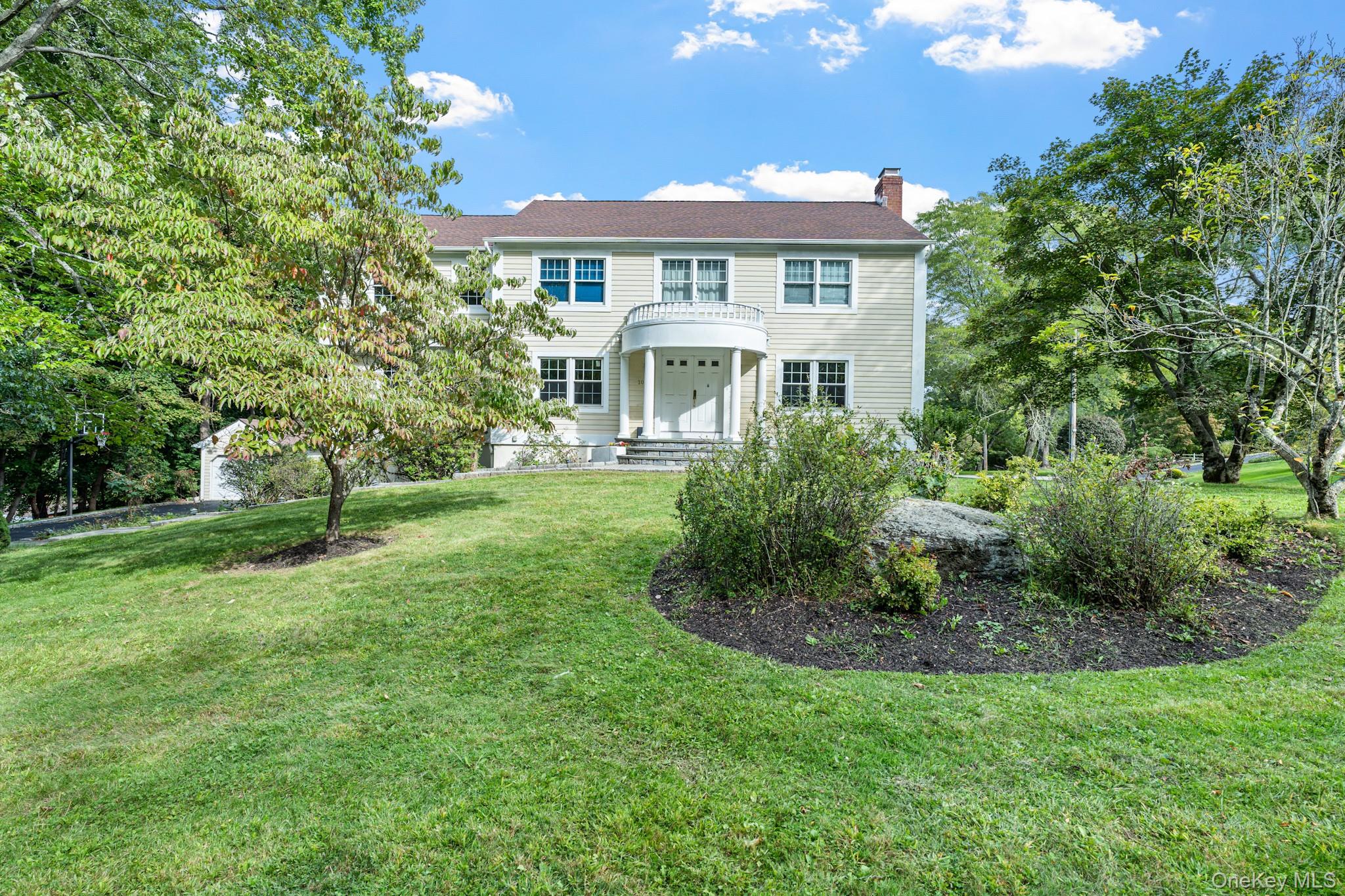 Welcome to this impressive 4-bedroom, 5-bath Colonial, beautifully sit...