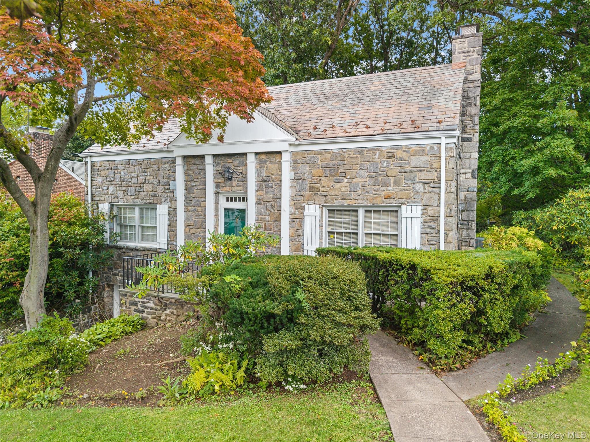 Beautifully sited with handsome stone architecture and wonderful curb...