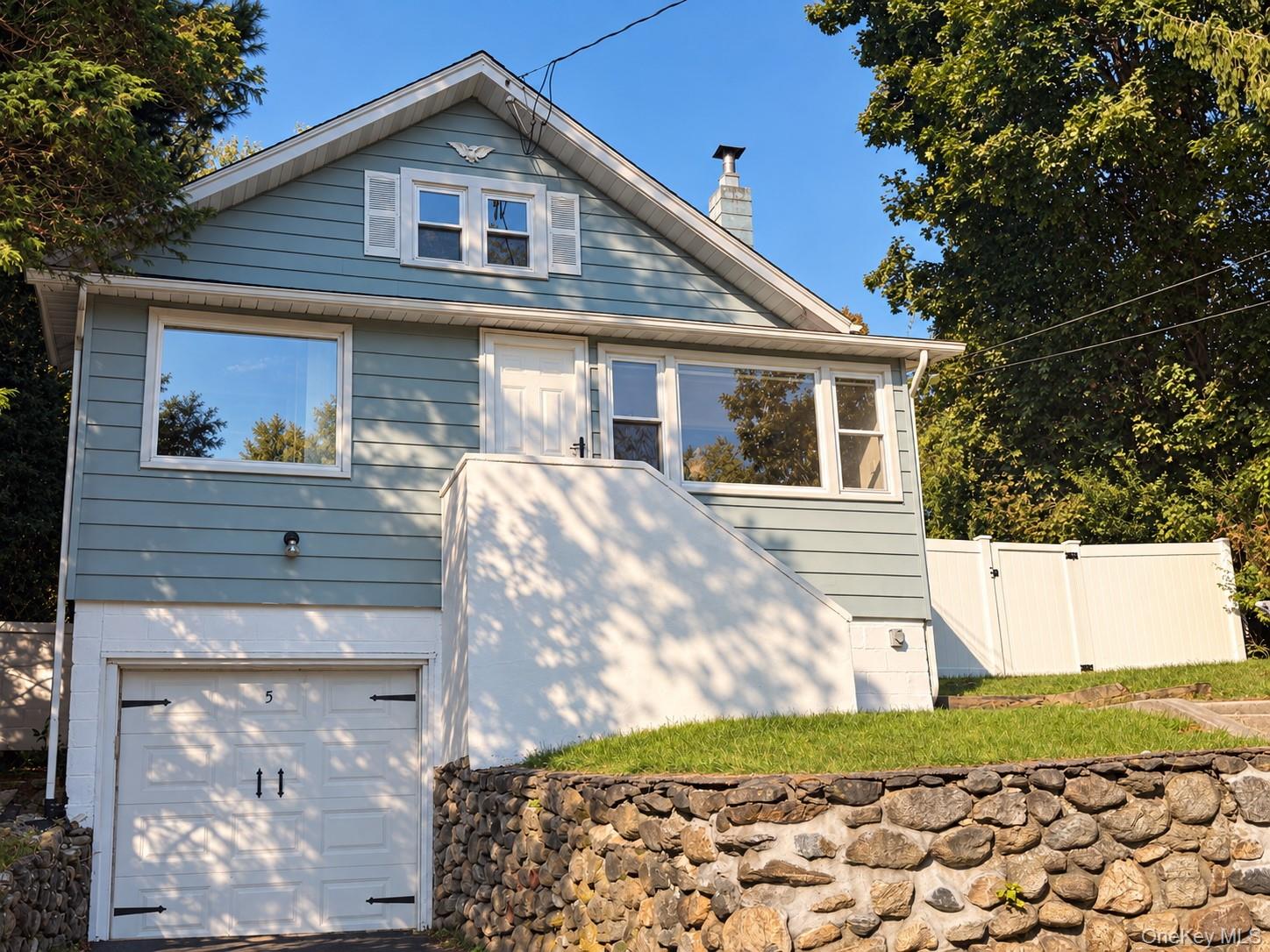 An updated, well-cared for Cape Cod classic set back on an elevated lo...