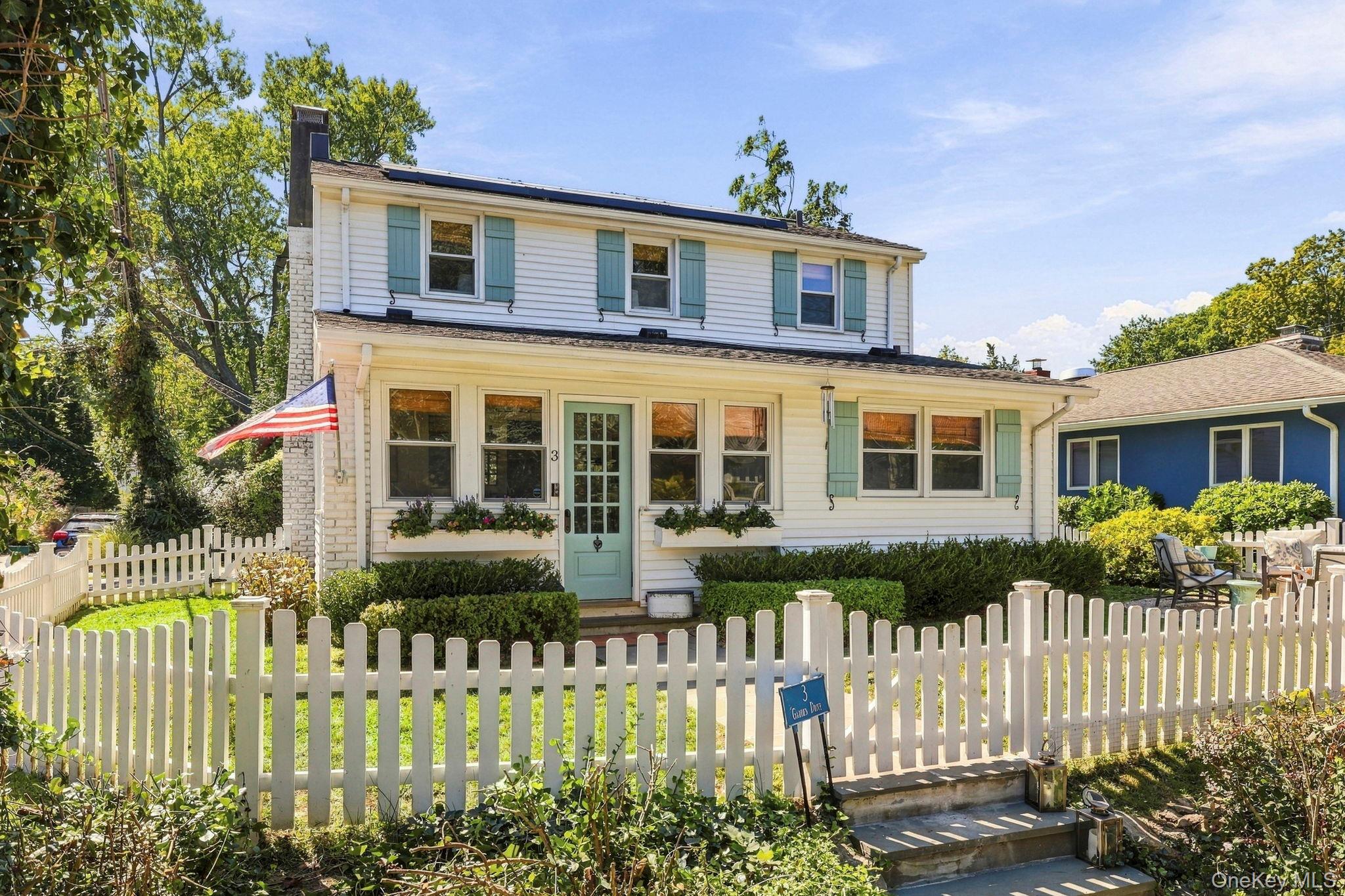 Coastal charm awaits at 3 Garden Drive! Abundant natural light and a w...