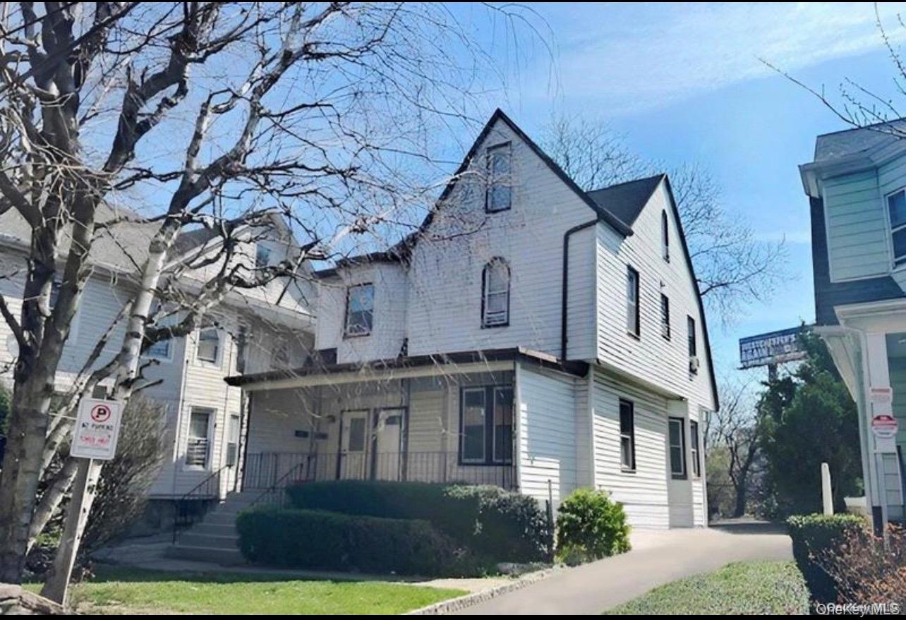 Welcome to well kept 2 family property that offers easy access to tran...