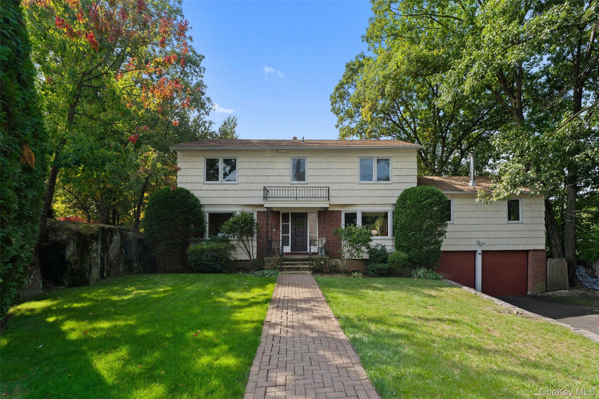 Perched atop a hill on a tranquil cul-de-sac, this four-bedroom Coloni...