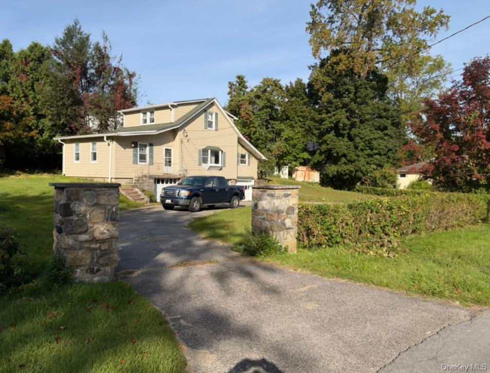 Beautifully landscaped .36-acre Cape Cod offering a flexible and invit...