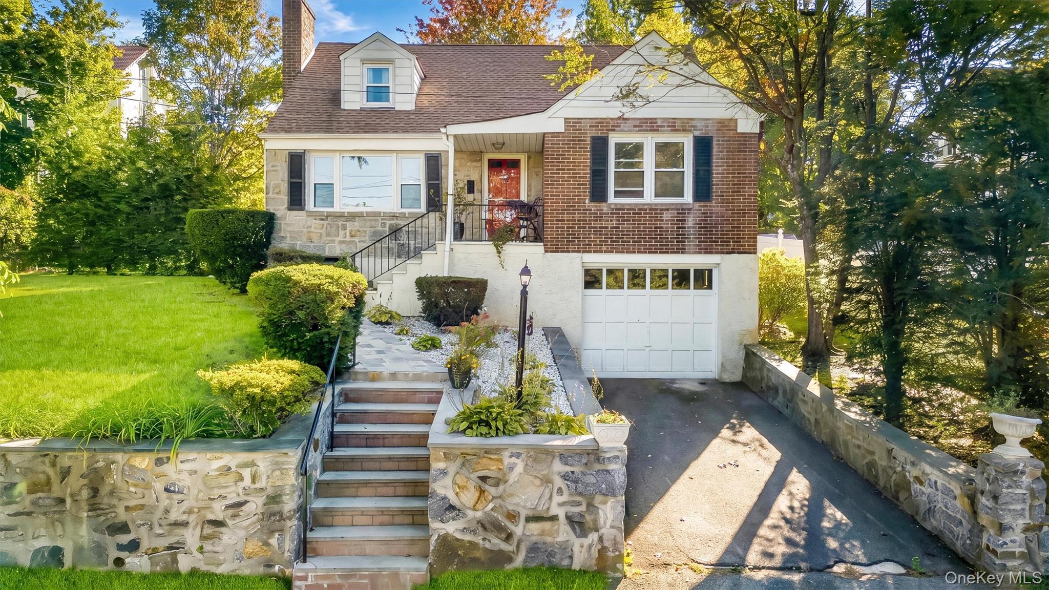 Welcome to this fabulous brick and stone Cape Cod-style home nestled i...