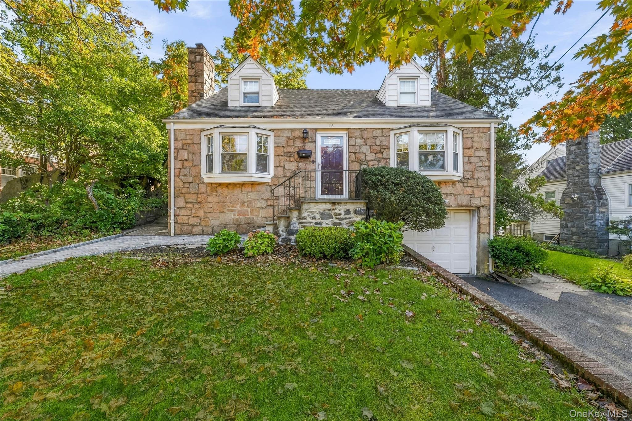 Welcome home to 26 Custer!  This stone front expanded Cape boasts 3 le...