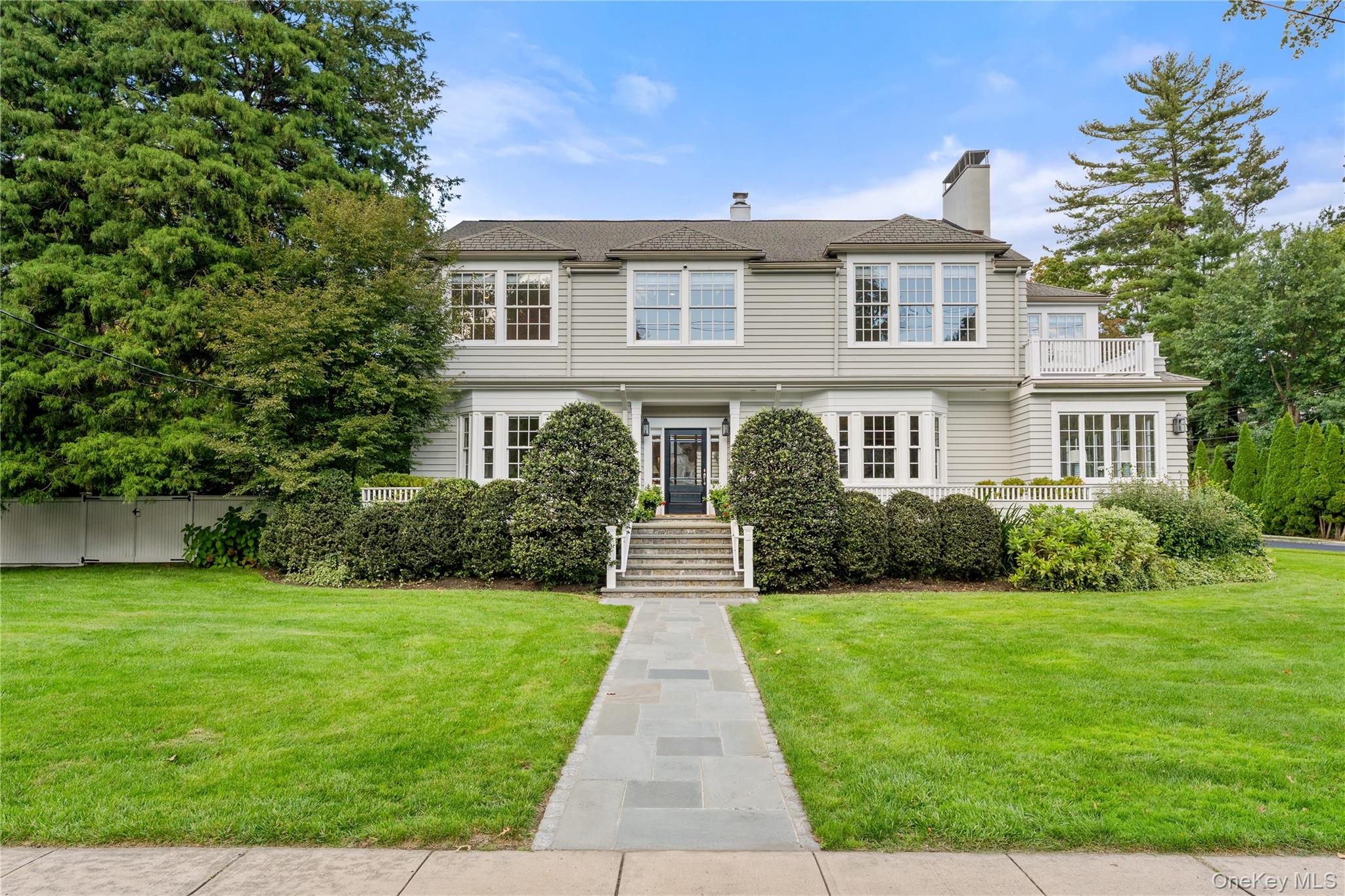 Set on a coveted corner lot of nearly half an acre in The Brook, one o...