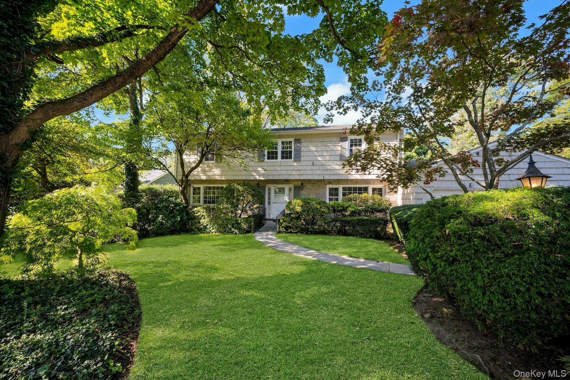 Welcome to this classic Center Hall Colonial, ideally situated in the...