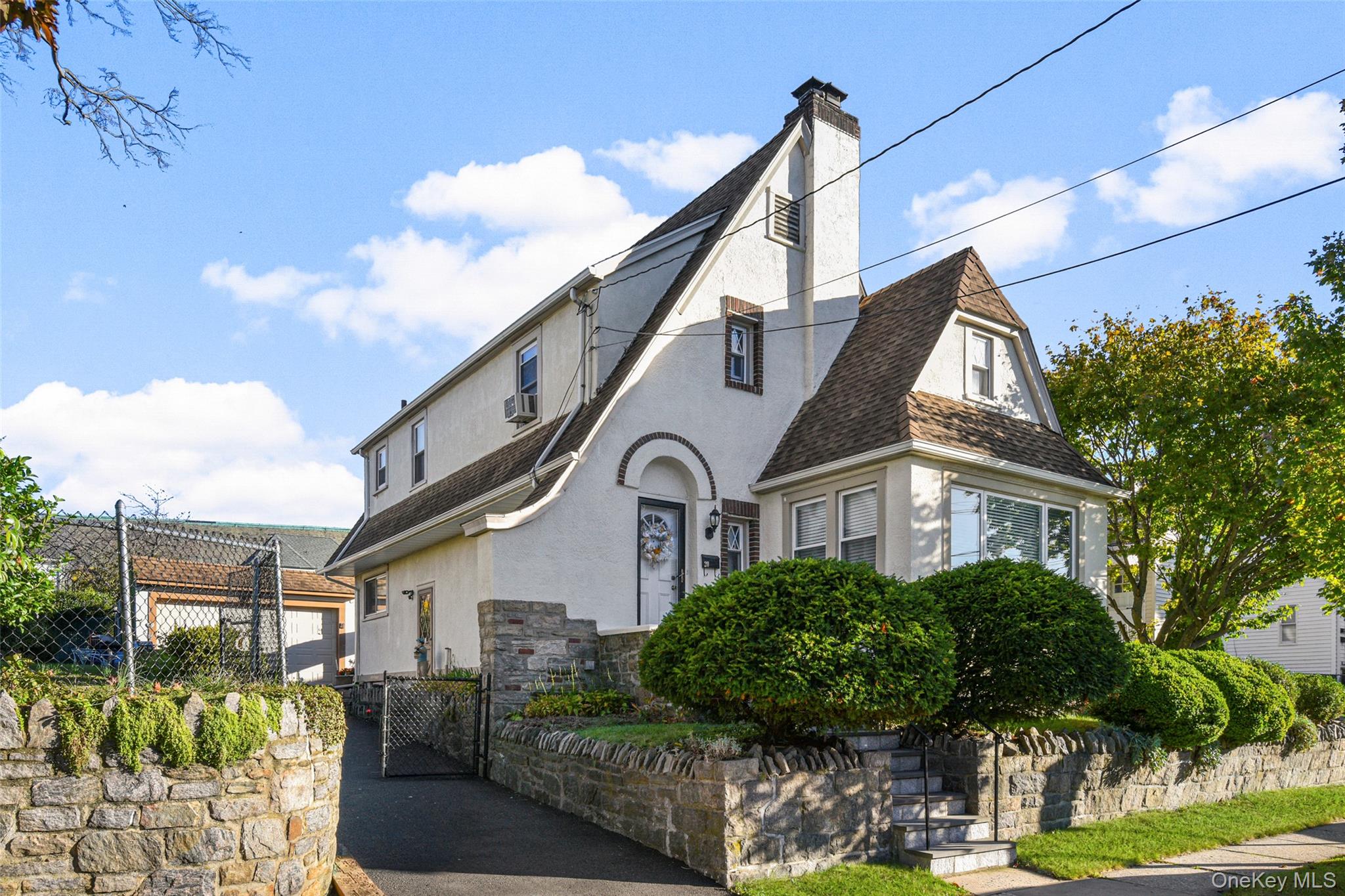 Welcome to this beautiful Tudor Revival home where classic architectur...