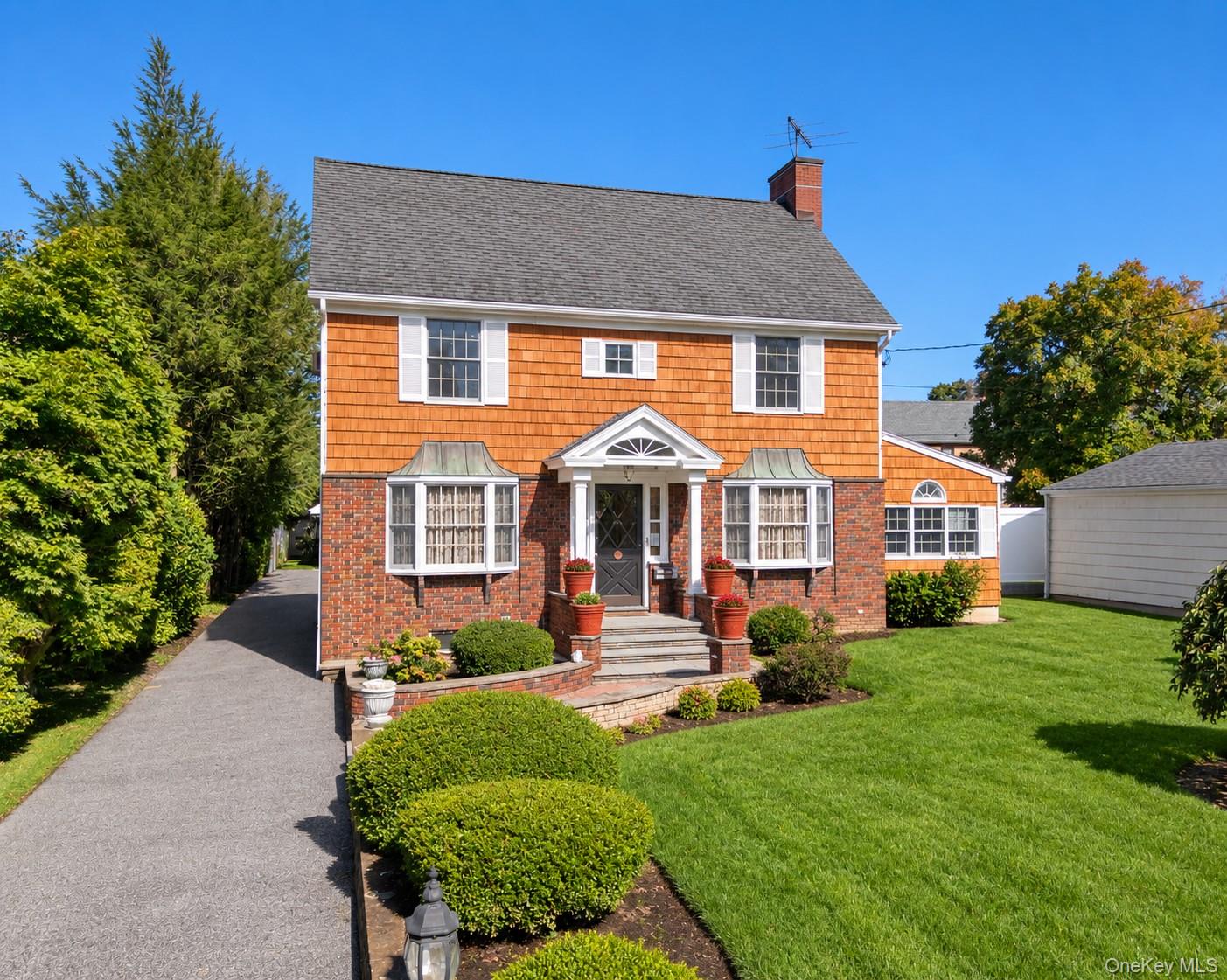 A distinguished custom colonial with exceptional craftsmanship and tim...