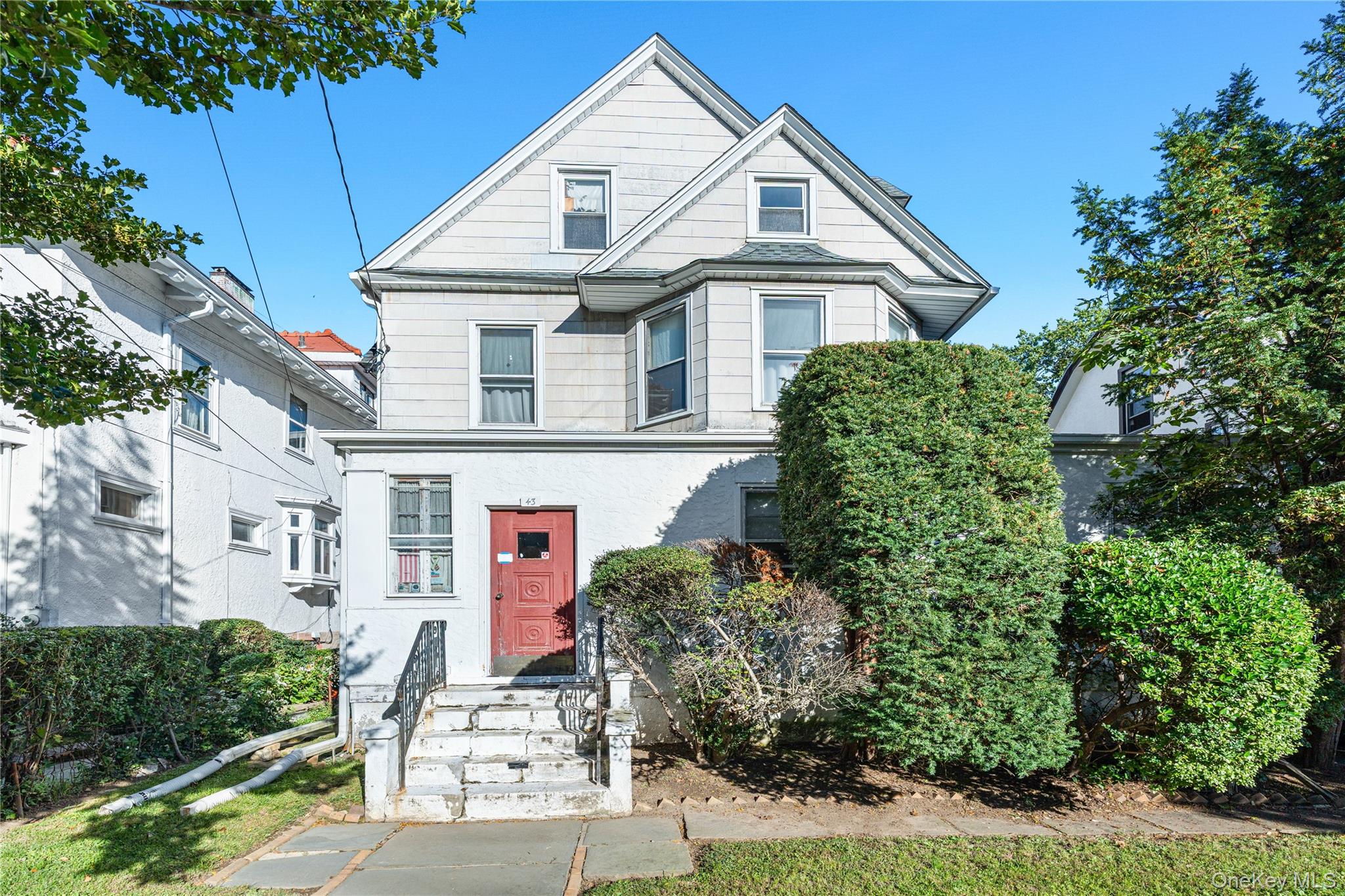 Calling all visionaries and investors! This oversized legal two-family...