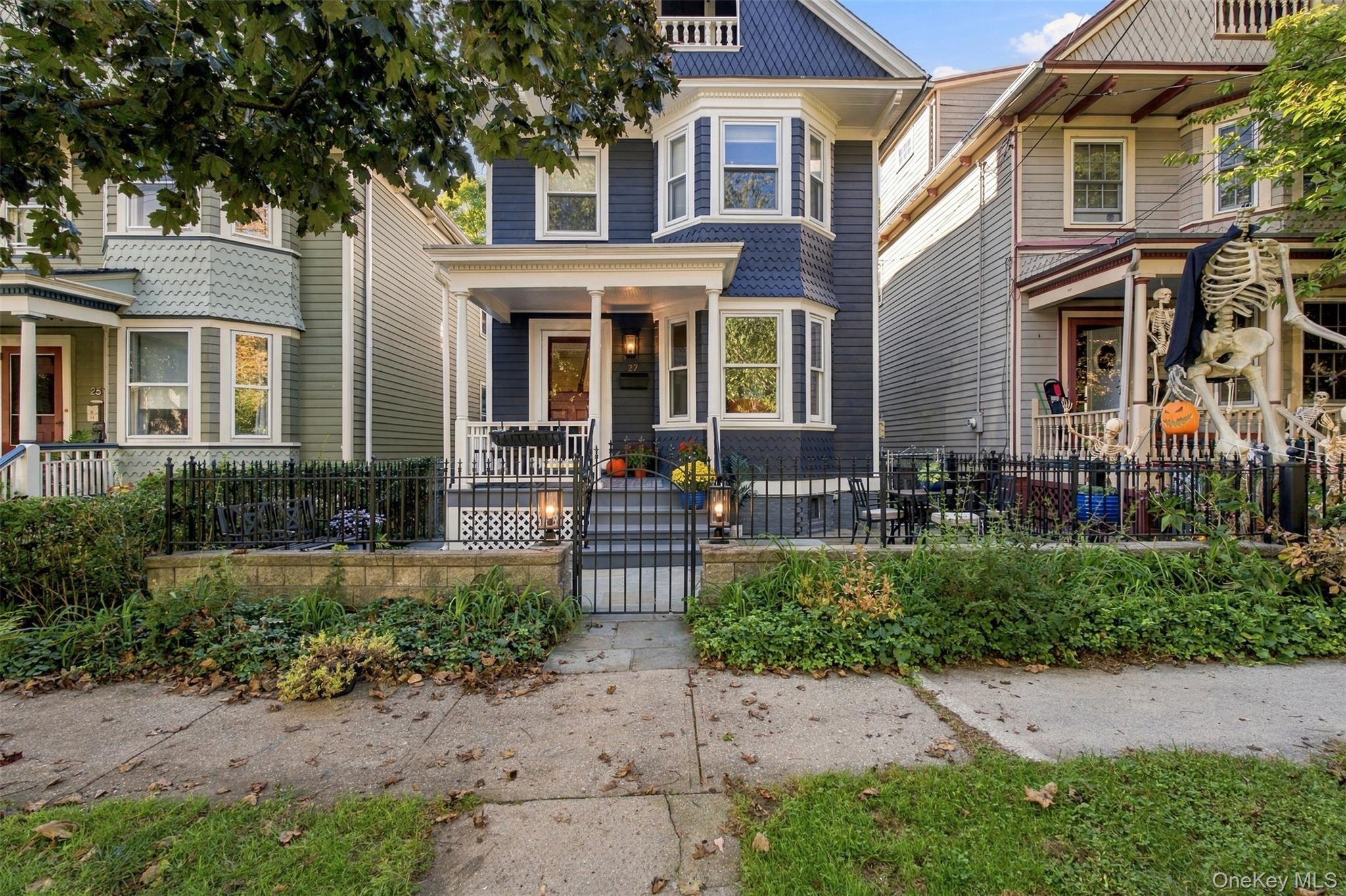 Built in 1906, this navy Victorian sits on a dead-end block that runs...