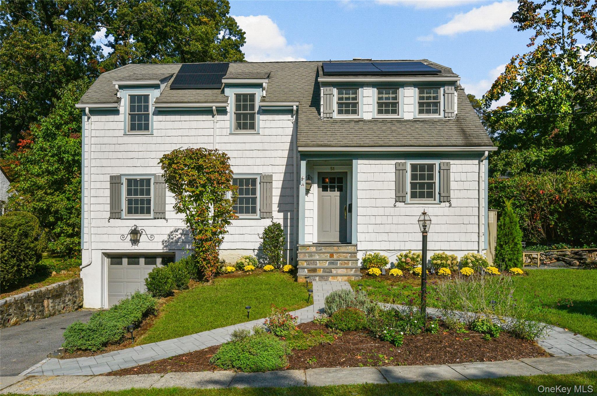 Tucked away in sought-after Larchmont Woods, this sun-filled Colonial...