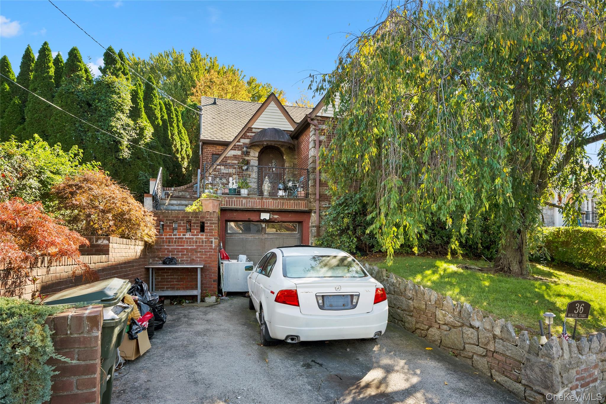 Classic Brick Tudor on an Oversized Hilltop Lot

Set high on a hill wi...