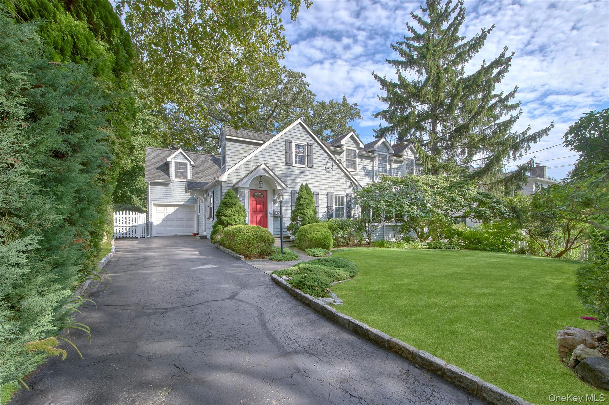 This charming Cape Cod Colonial offers a quiet location with landscapi...