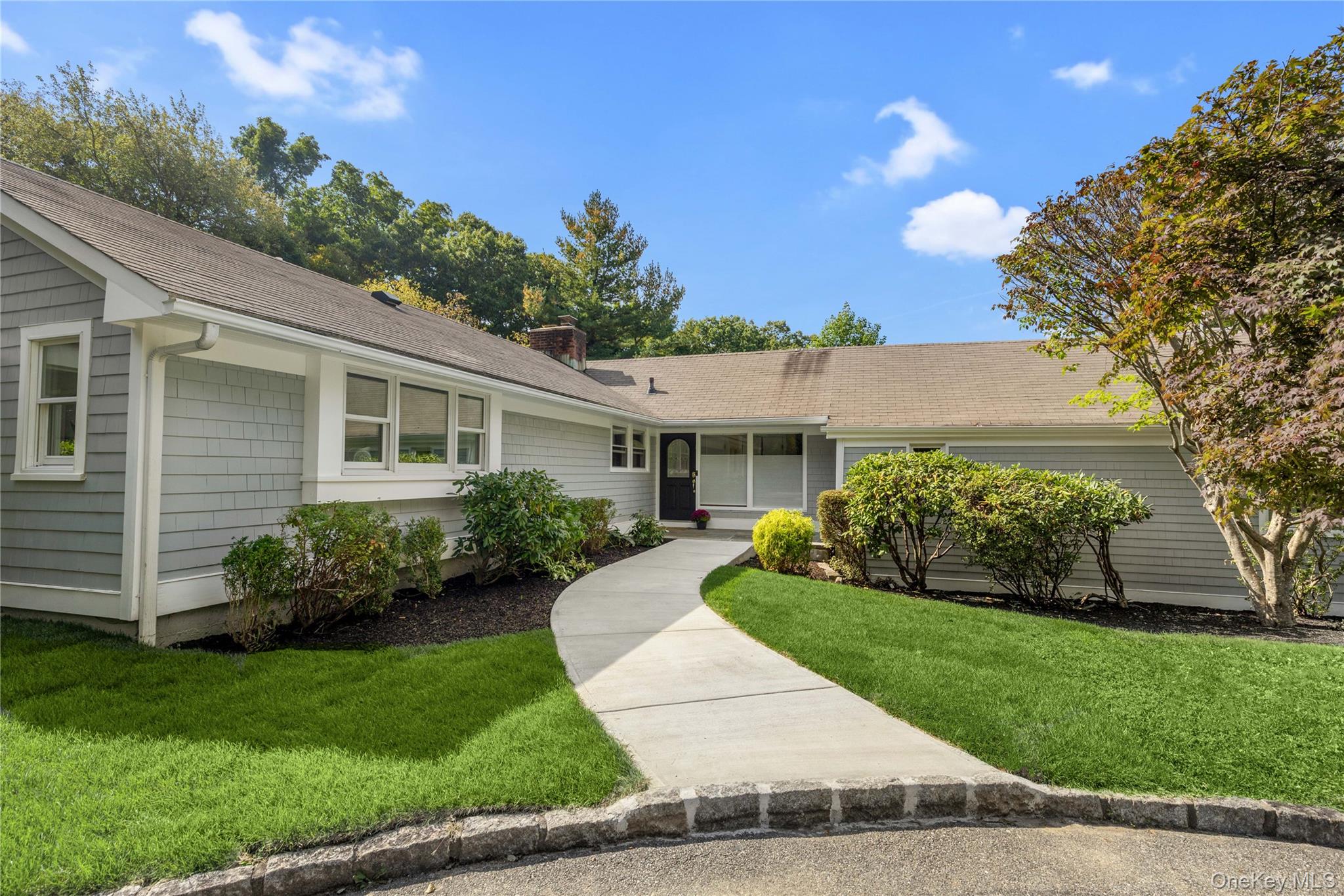 Set on a private property in Armonk, this one-family residence offers...