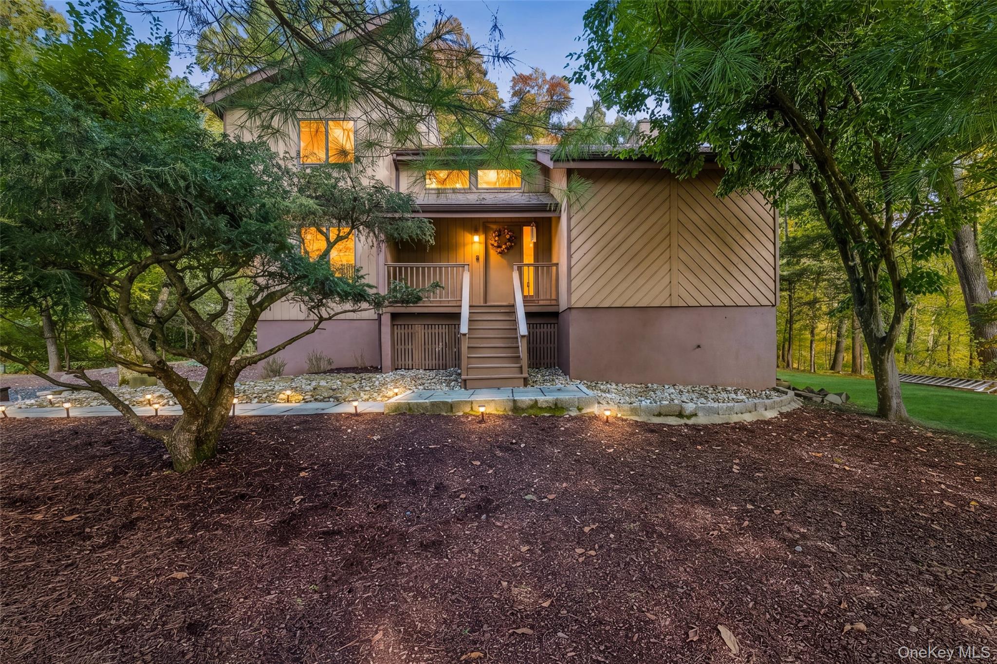 Set on a private shy acre along a sought-after cul-de-sac, this sun-fi...