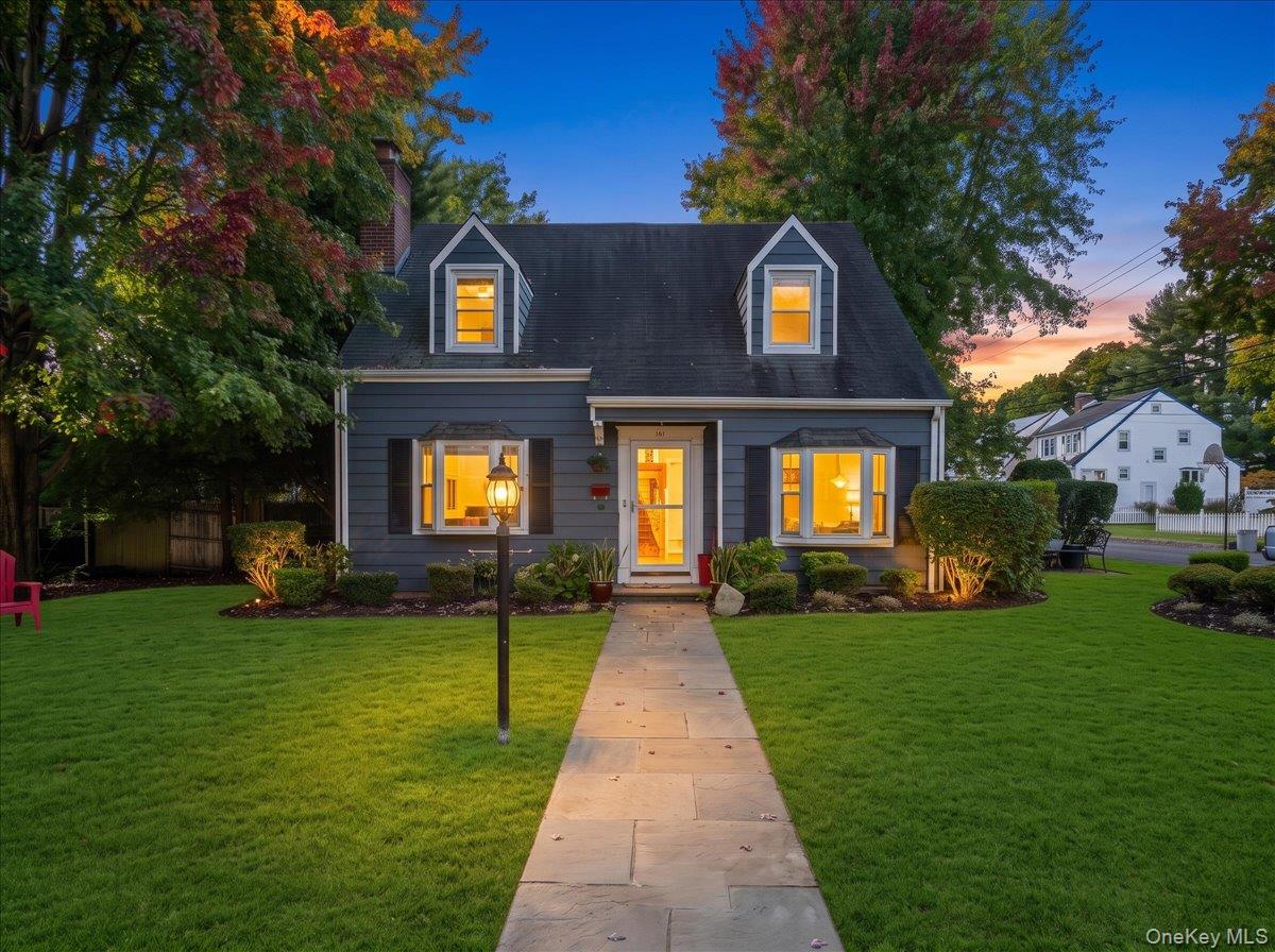Sitting Pretty on Robins Road! Come discover this sunny Cape-style hom...