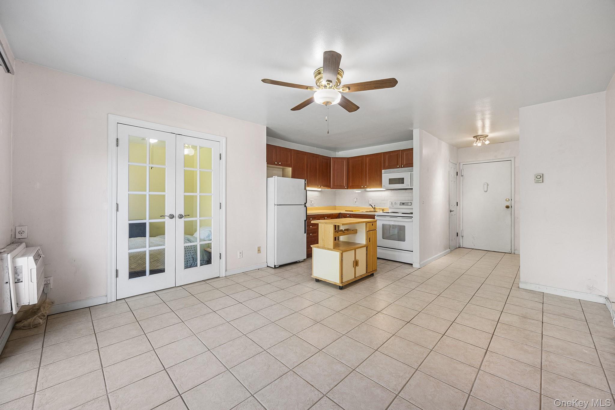 Enjoy top-floor living in this inviting junior one-bedroom condominium...