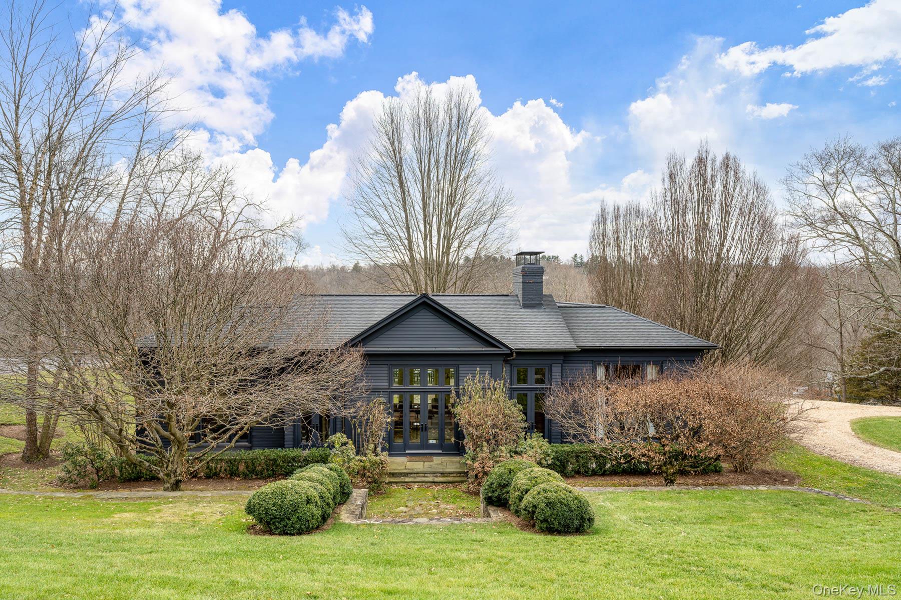 Sophisticated carriage house on over 8 acres. Beautifully furnished an...