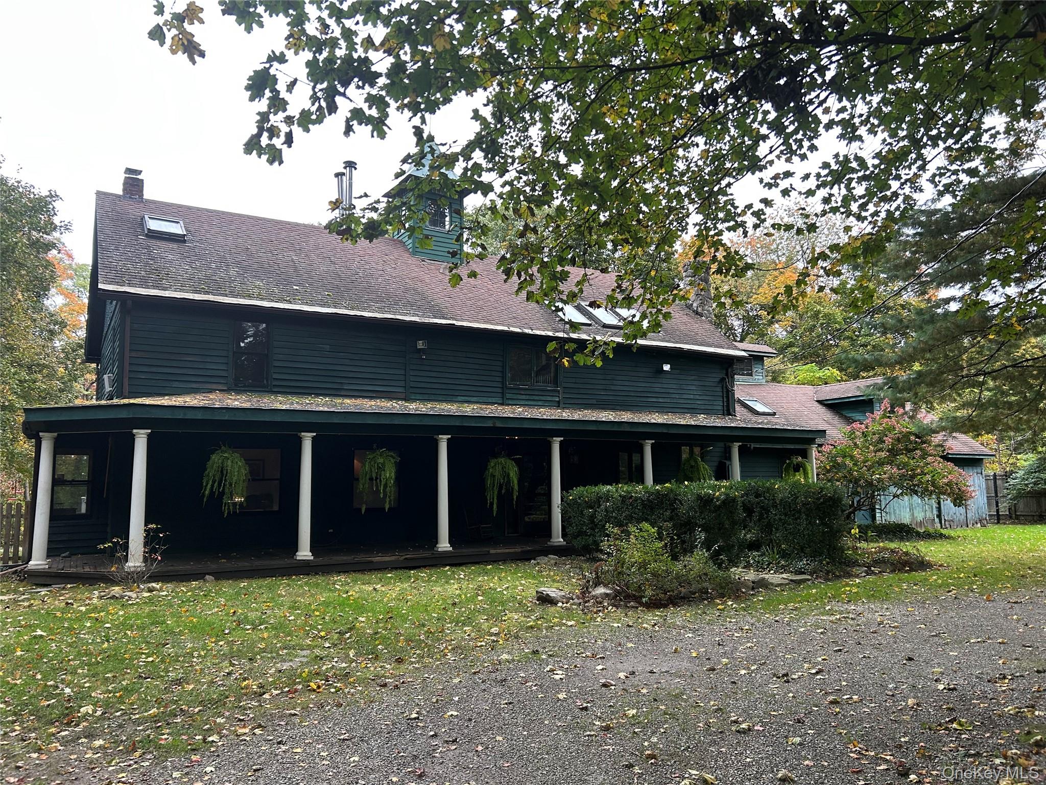 Set on two picturesque acres in a hidden private setting, this circa 1...