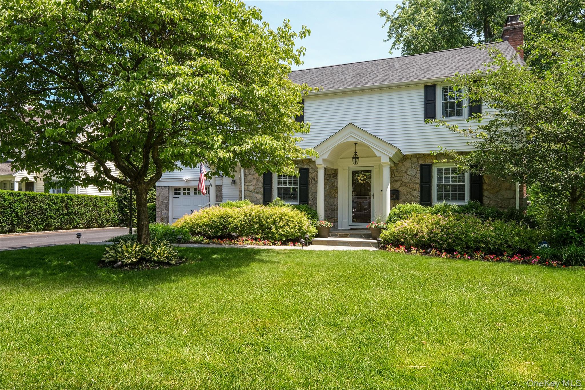 Fall in love with this charming stone-front Colonial, ideally situated...