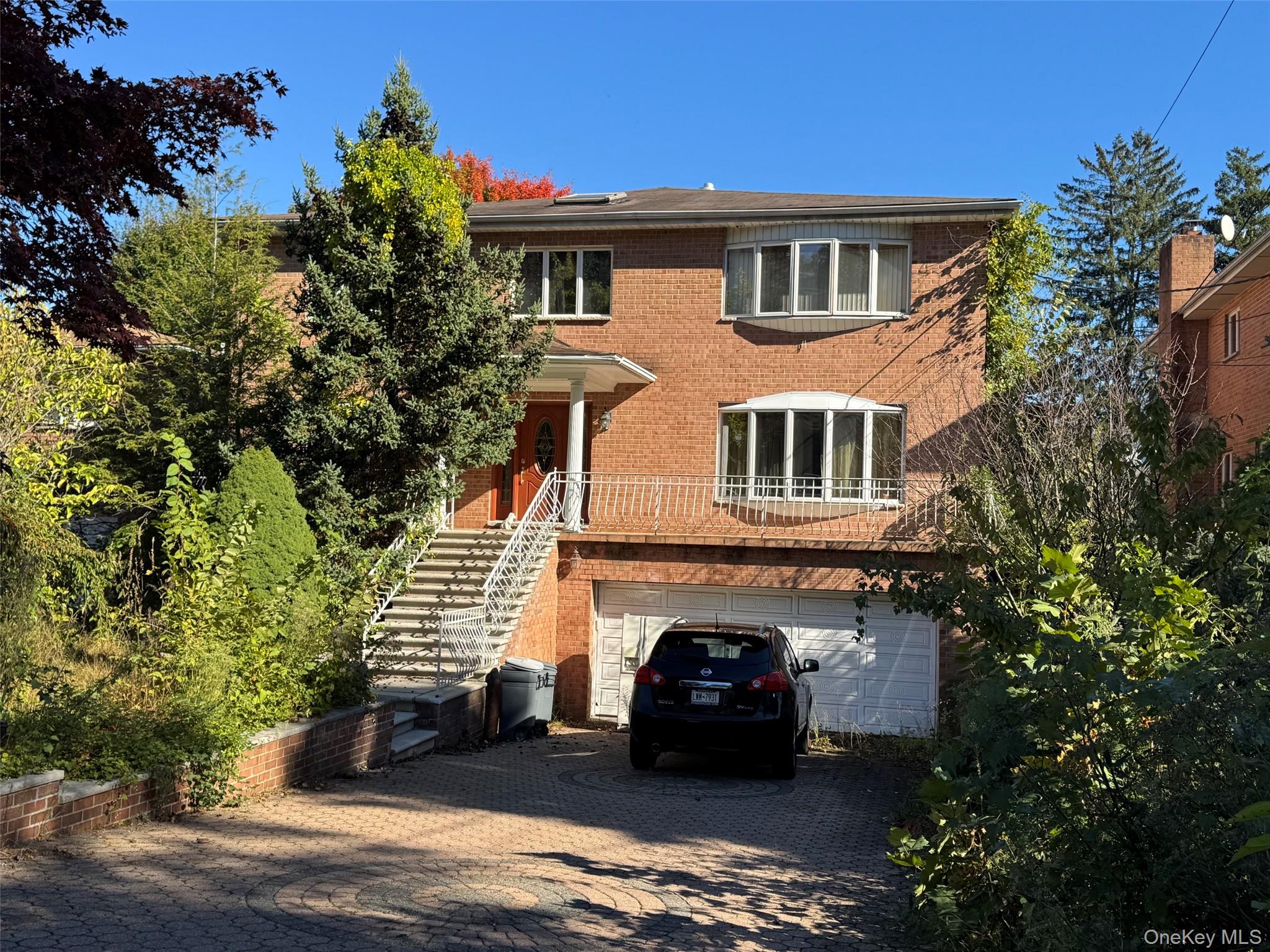 Large detached brick single family with a walk out basement and attach...