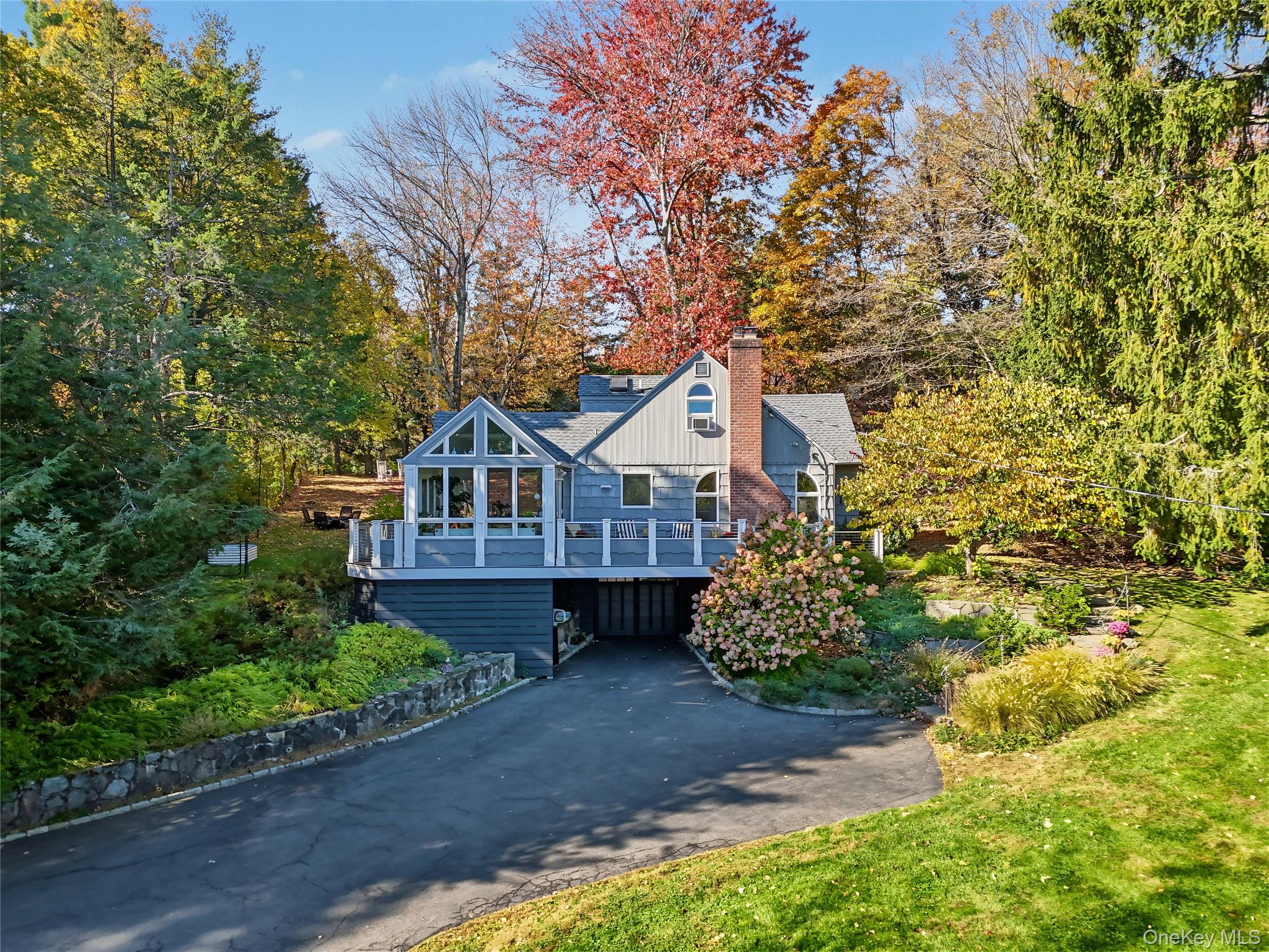 Lovely expanded 4 BR/2 BA Cape with fabulous curb appeal, set on a bea...