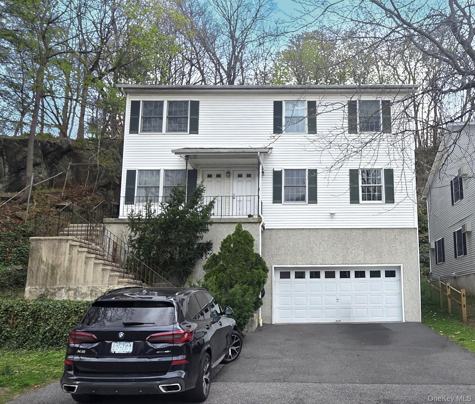 Top floor apartment in two-family home conveniently located less than...