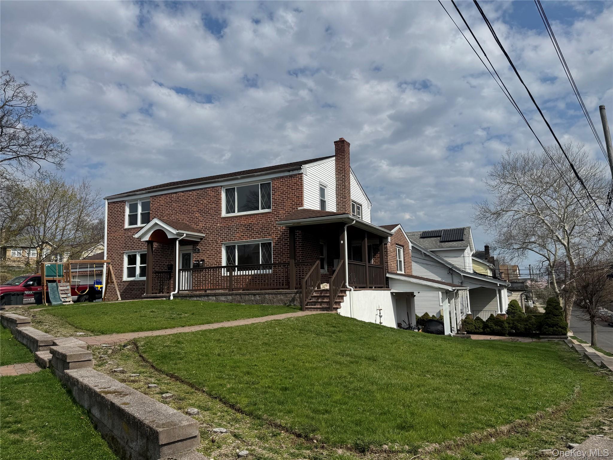 This amazing investment solid brick two-family residence with a spacio...