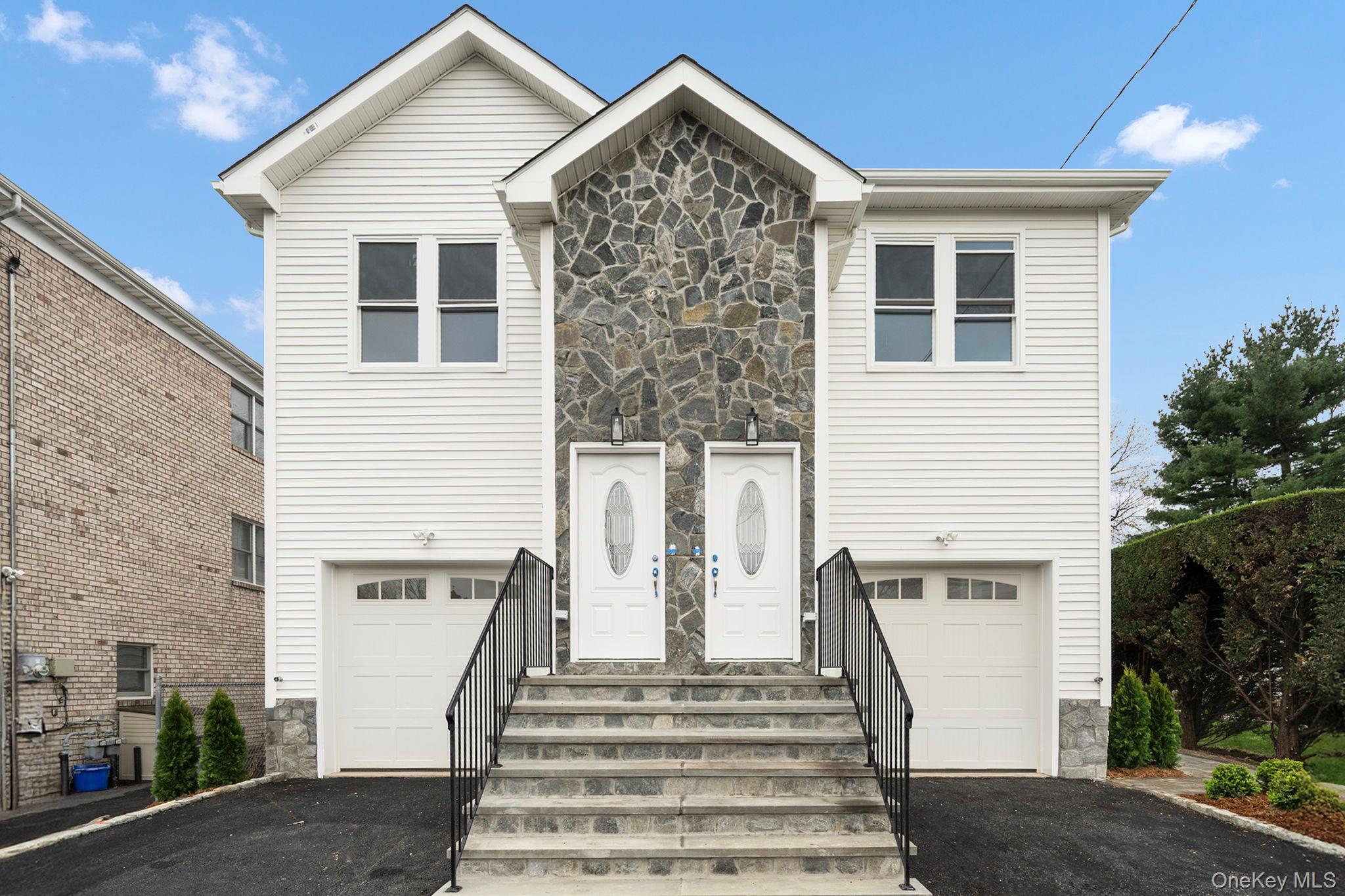 A touch of class best describes this HUGE meticulous brand new two fam...