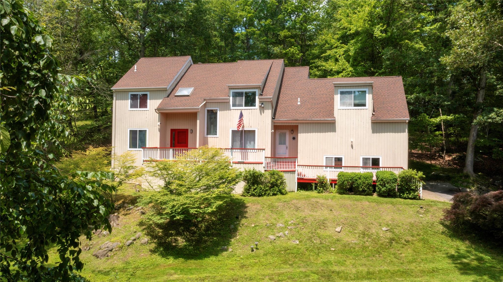 Tucked away on a gentle hill towards the back of its 1.49-acre lot, th...